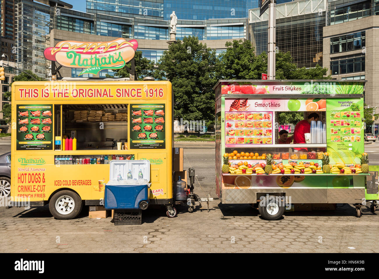 New York, USA - June 18, 2016: Hot dog and smoothie food trucks on Columbus Circle in New York City Stock Photo