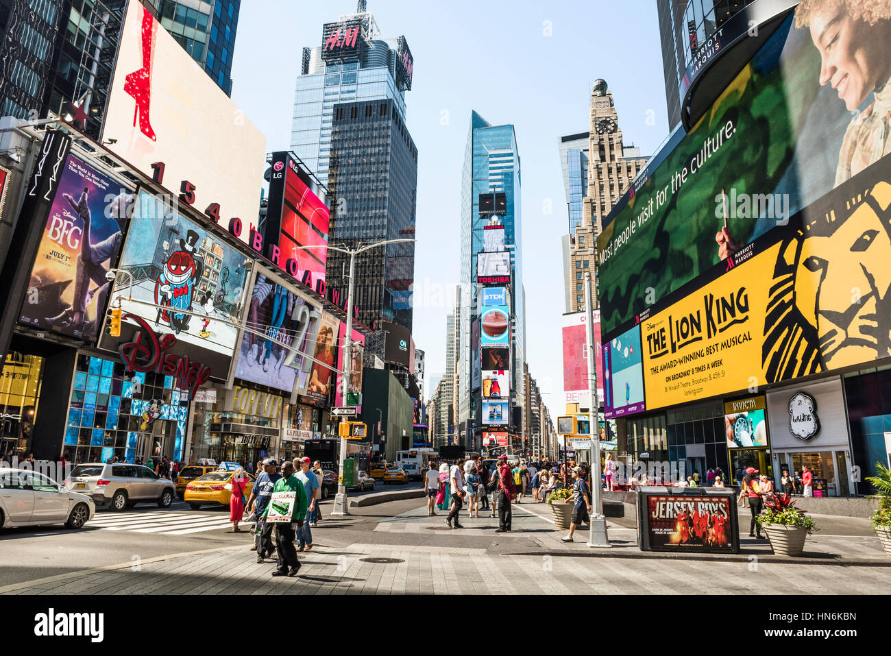 New York, USA - June 18, 2016: Times Square during the day with advertisements for the Lion King musical and stores such as Forever 21 and H&M Stock Photo