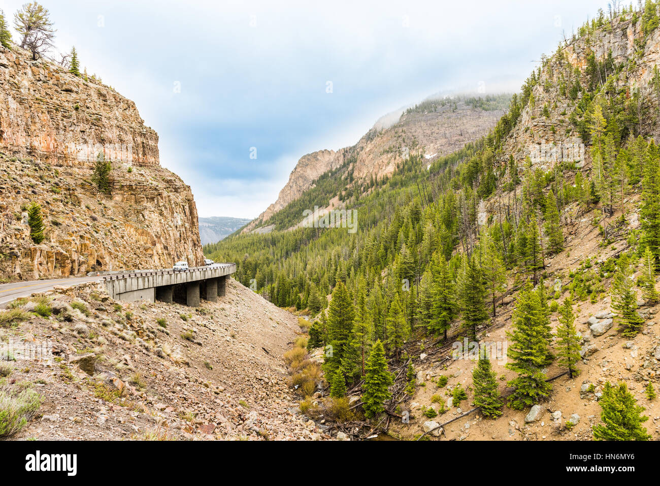 Sharp turn on curvy road in rocky canyon mountain in Yellowstone