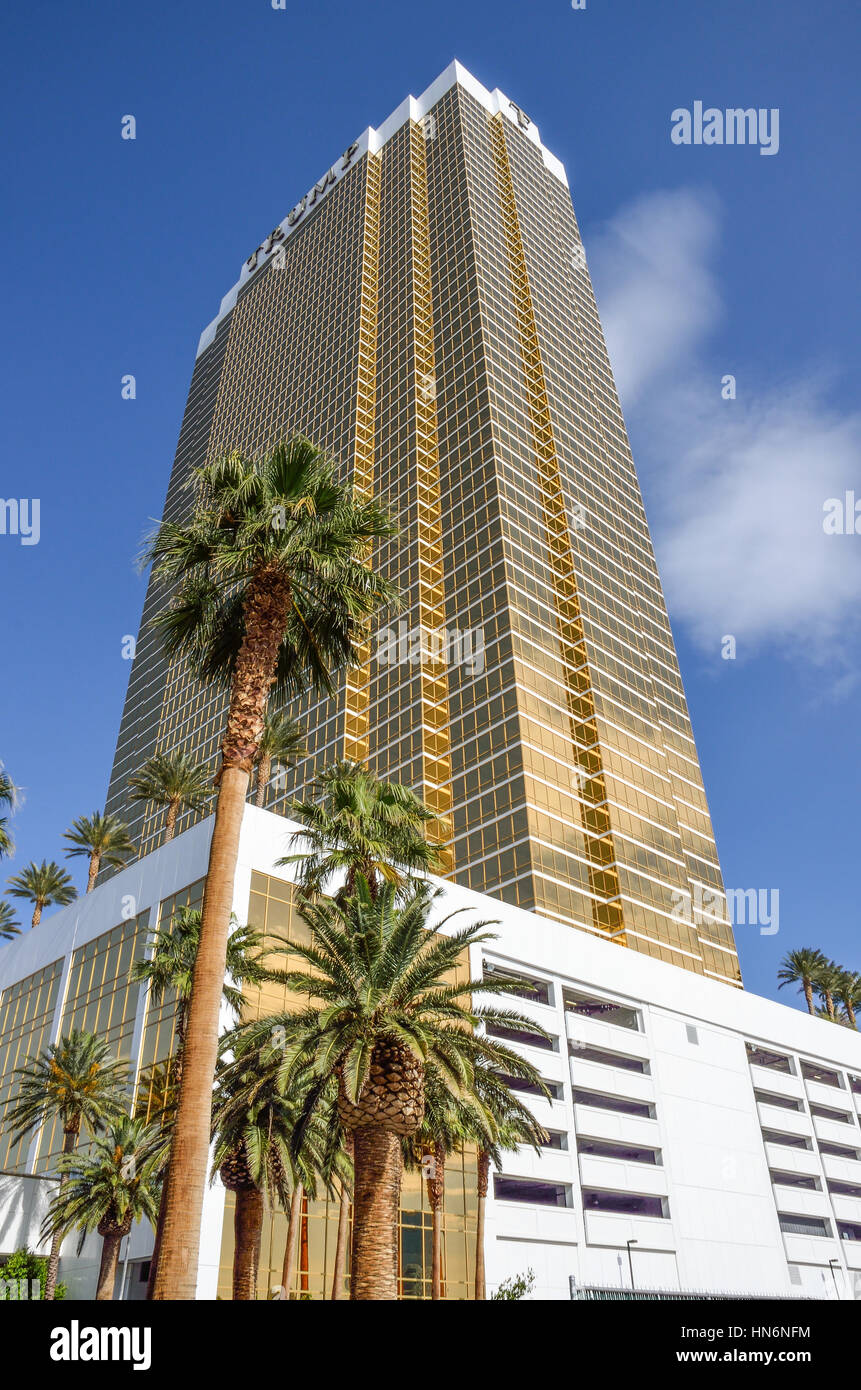 Las Vegas, USA - May 7, 2014: Closeup of Trump tower hotel with gold plated windows and palm trees Stock Photo