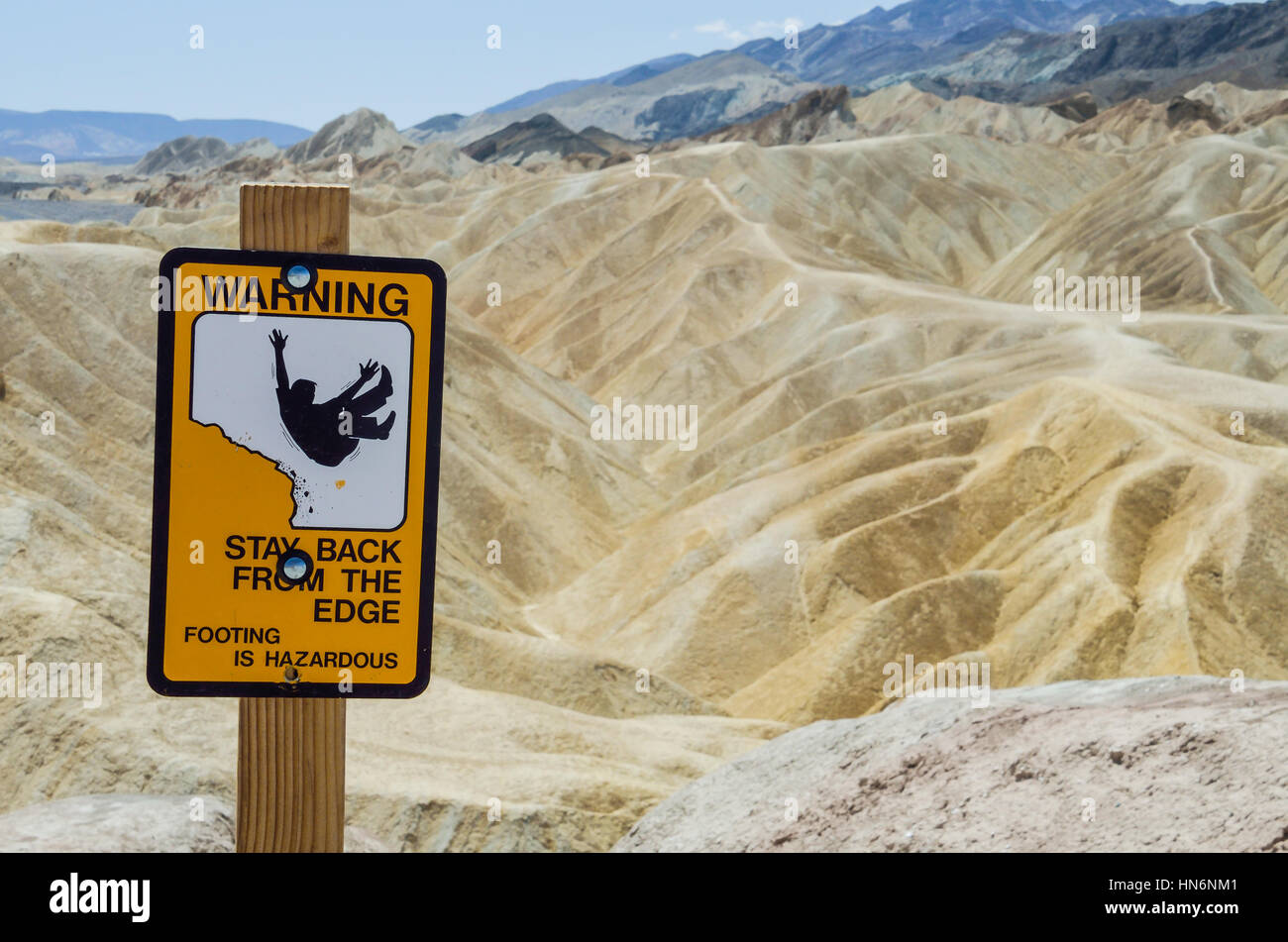 Warning sign at Zabriskie Point furnace creek formations in Death