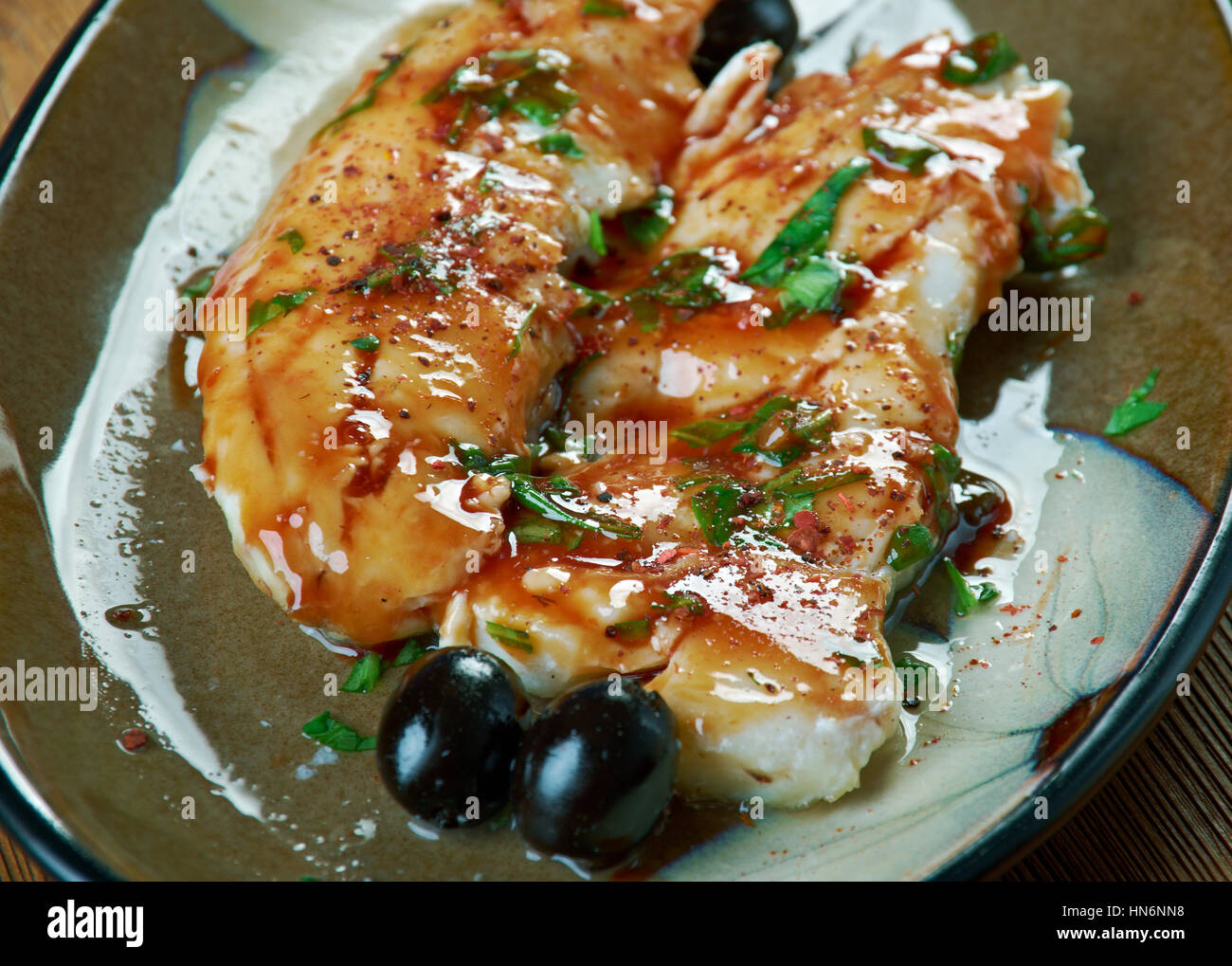 PanSeared Cod in White Wine Tomato Basil Sauce Stock Photo Alamy