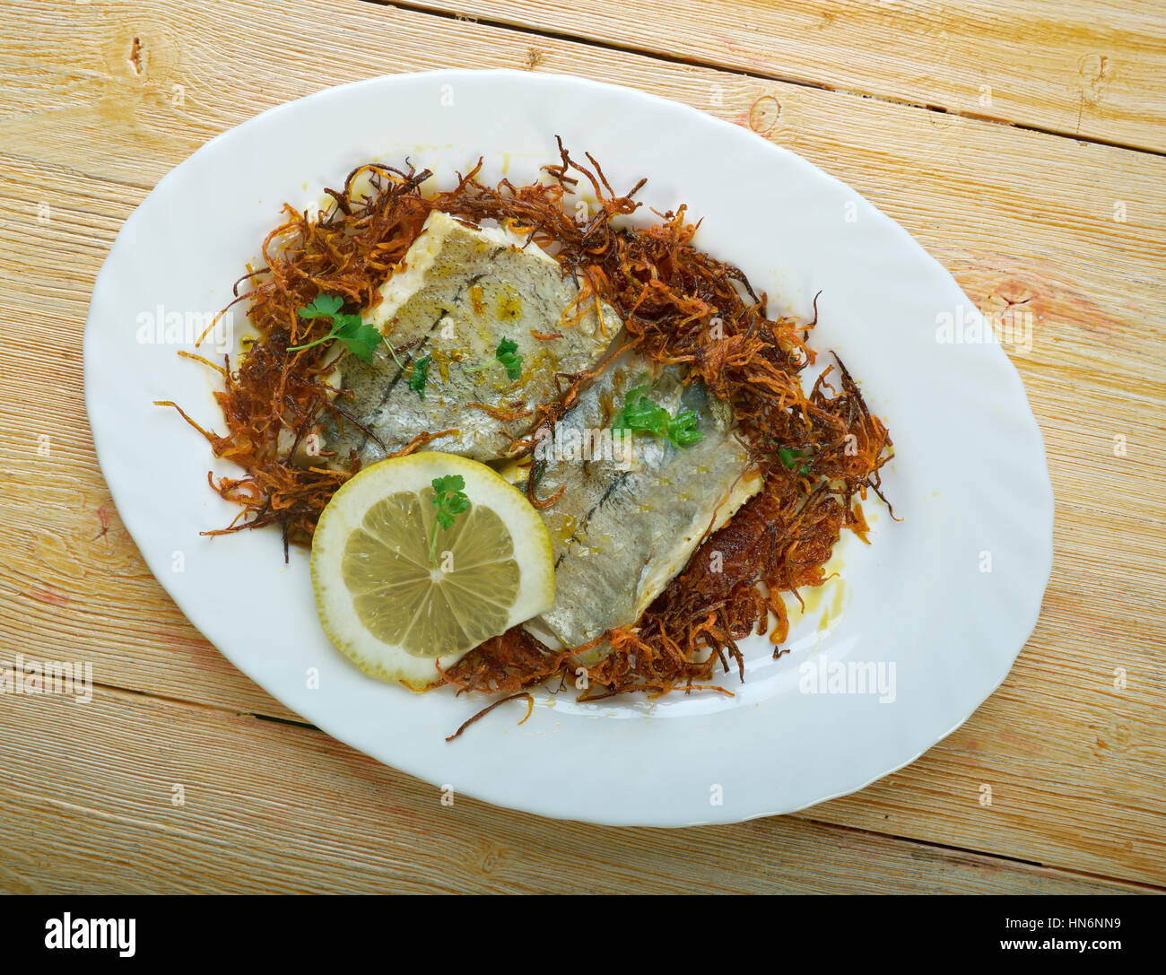 Hake with Bayonne Ham. Panfry hake steaks in a bit of olive oil; set