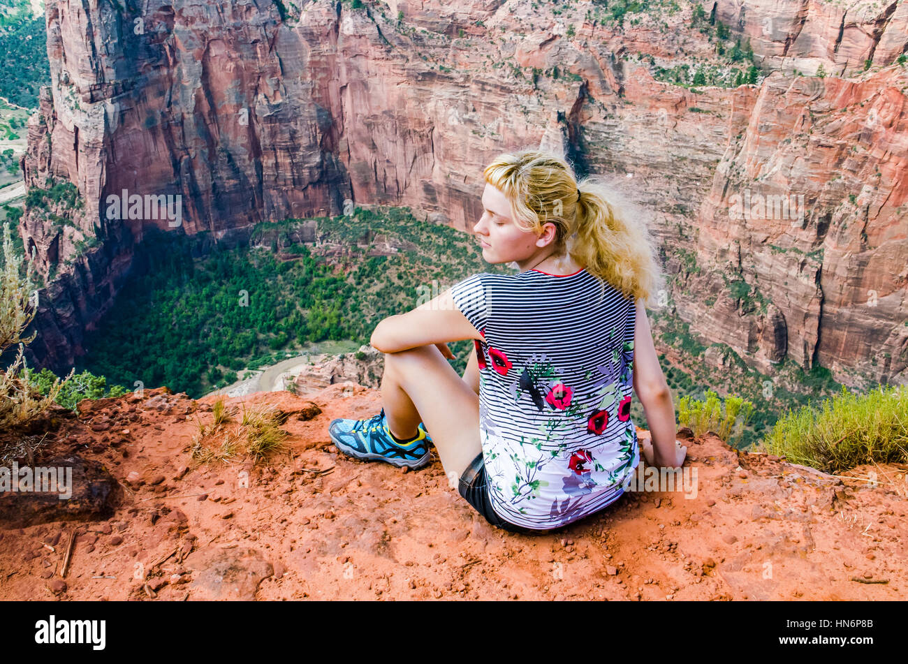 Girl sitting on edge cliff hires stock photography and images Alamy