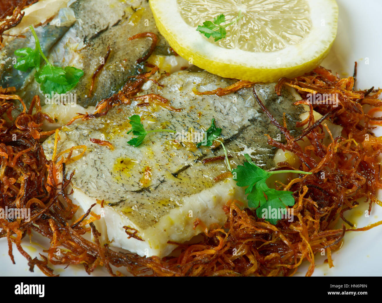Hake with Bayonne Ham. Panfry hake steaks in a bit of olive oil; set