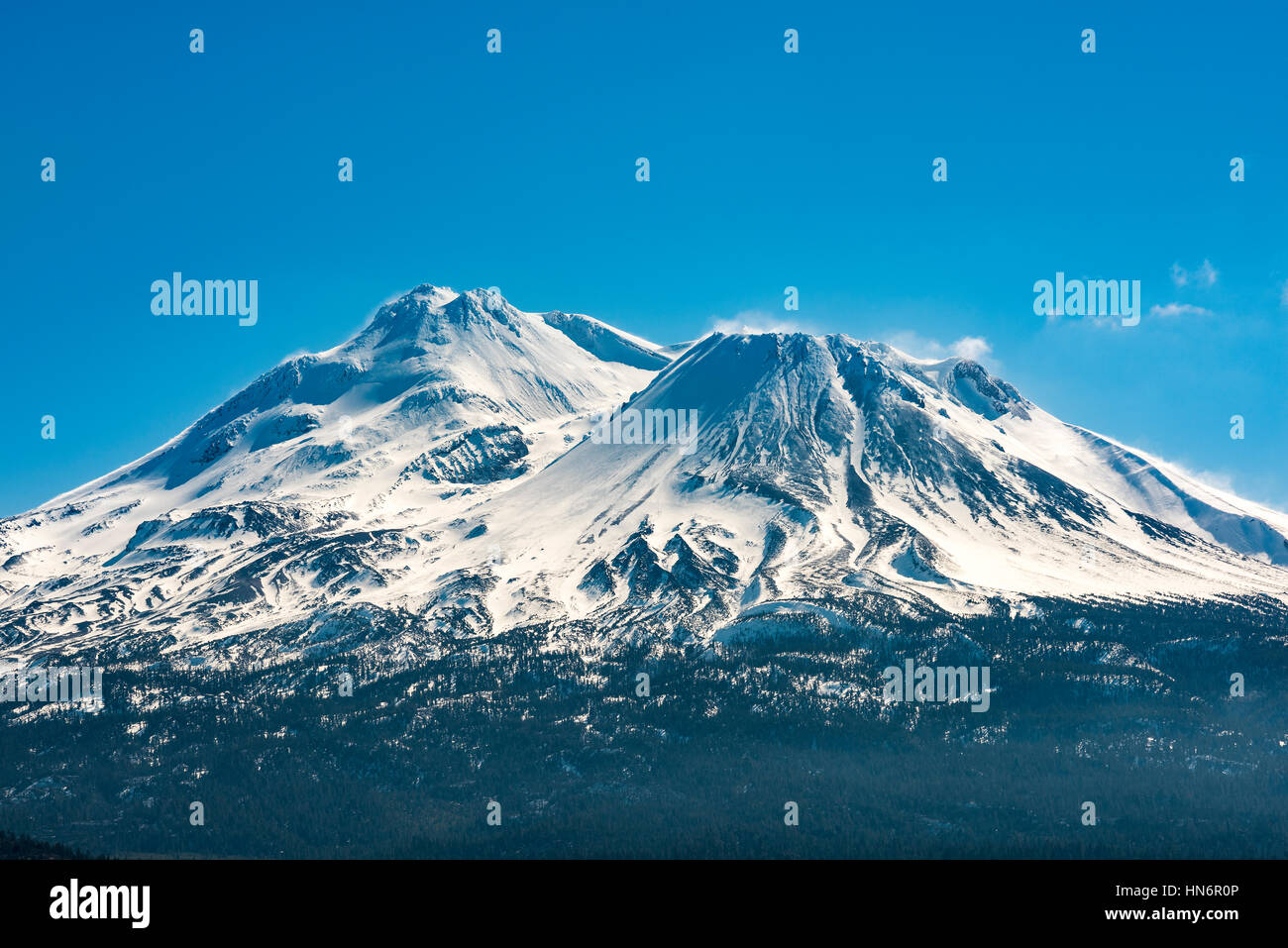 Snowcapped Mount Shasta volcano during winter blue closeup Stock Photo