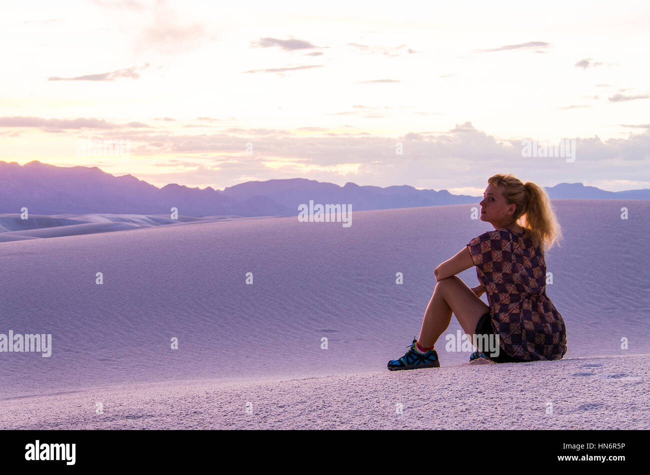 Woman watching sunset in desert hi-res stock photography and images - Alamy