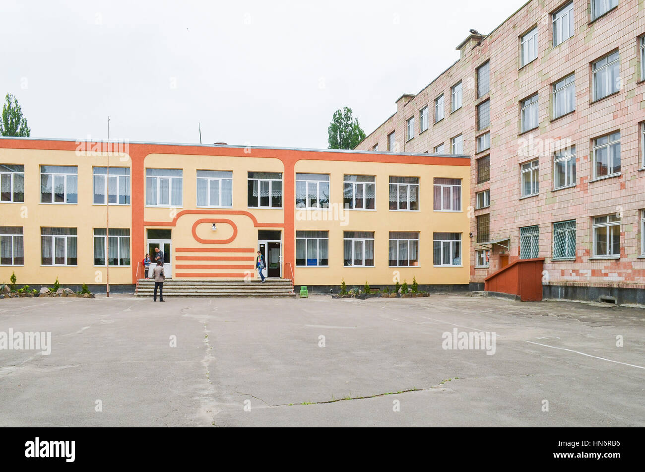Rivne, Ukraine - May 14, 2013: Secondary school number 13 entrance with people walking Stock Photo