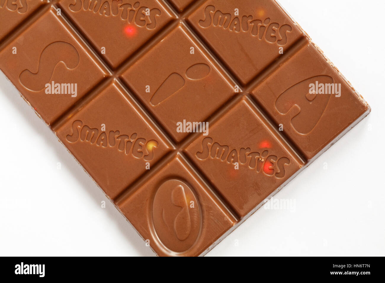 Bar of Nestle Smarties Festive Sharing Block of chocolate out of wrapper showing chocolate squares Stock Photo