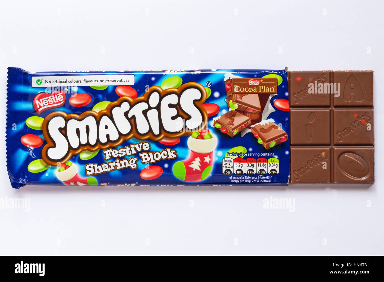 Bar of Nestle Smarties Festive Sharing Block of chocolate opened to show contents isolated on white background - showing chocolate squares Stock Photo