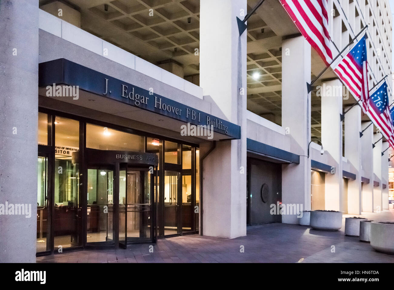 Washington DC, USA - December 29, 2016: FBI, Federal Bureau of Investigation Headquarters, on Pennsylvania avenue sign with American flags Stock Photo