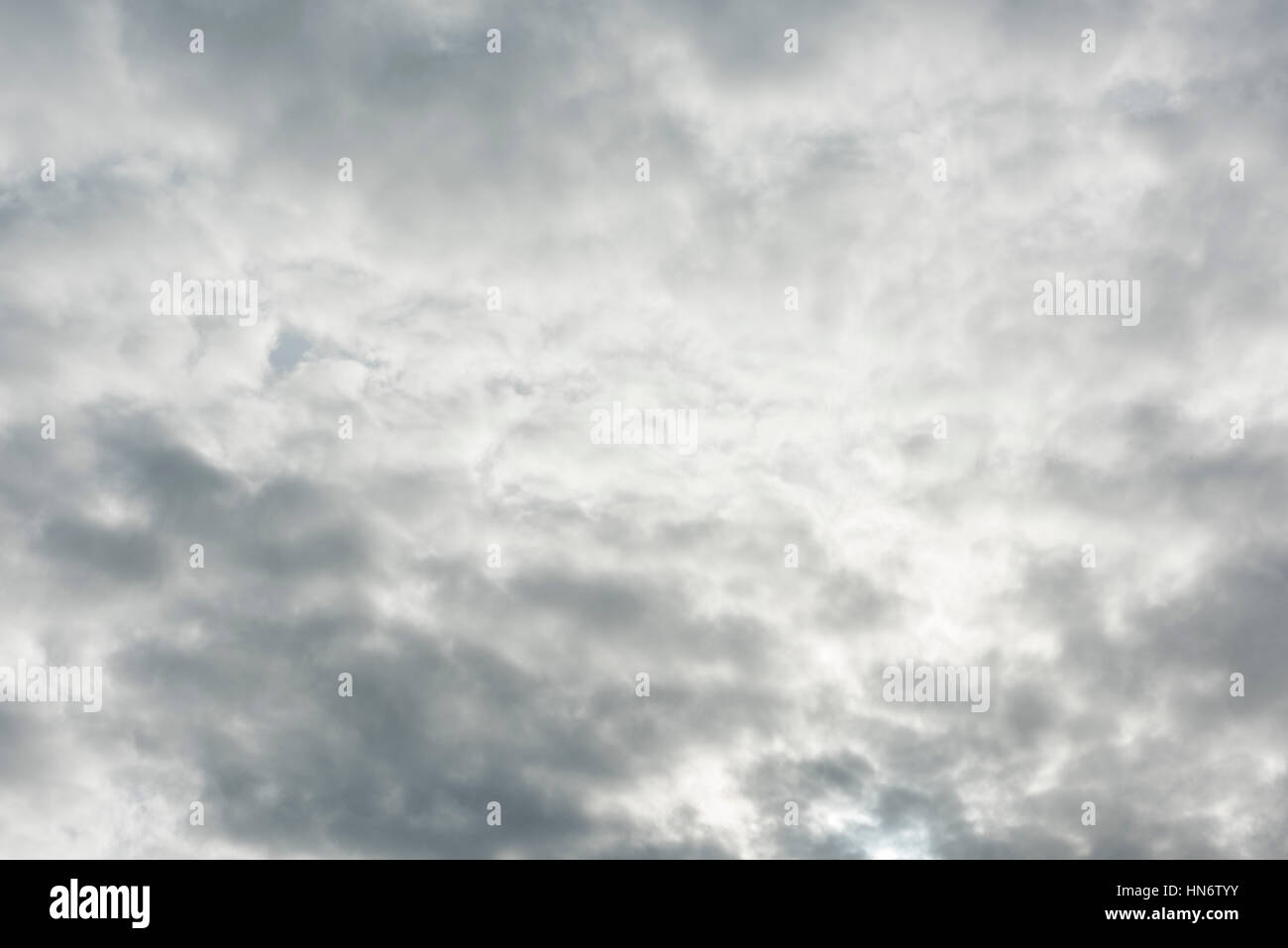 Stormy grey clouds sky background with sunlight Stock Photo - Alamy