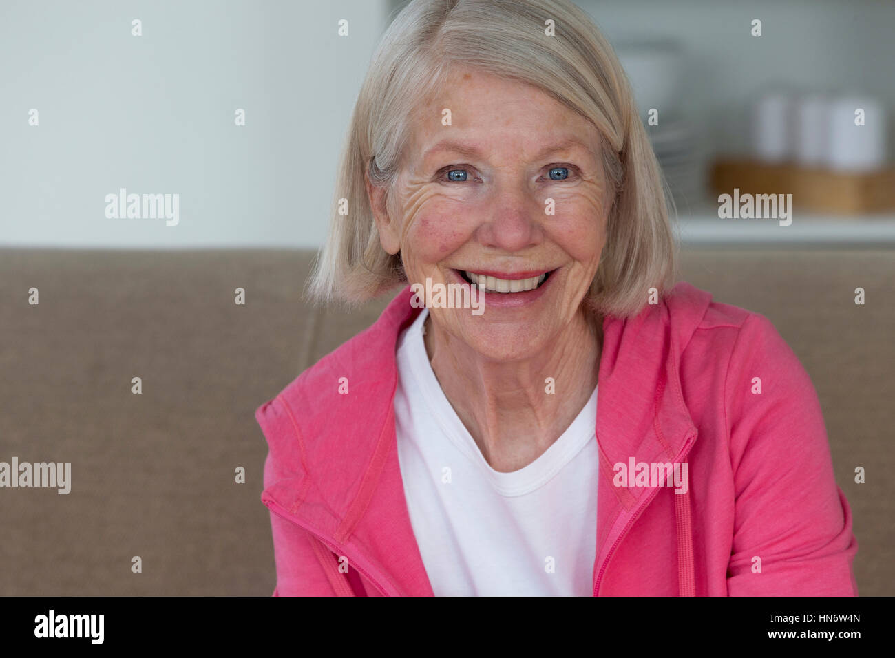 Portrait of a senior woman. She is smiling and looking at the camera ...