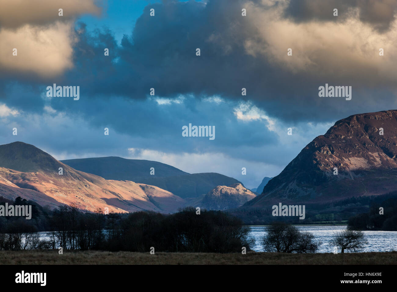 Sunlight on Rannerdale Knotts, seen from Loweswater, Lake District, Cumbria Stock Photo