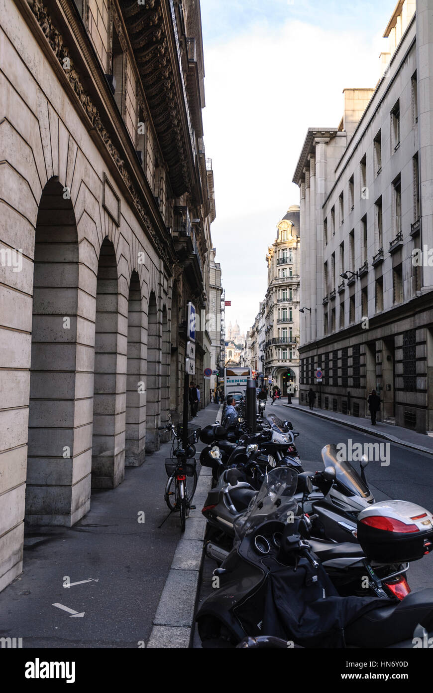 A line of motorcycles parked in a street in Paris, France Stock Photo