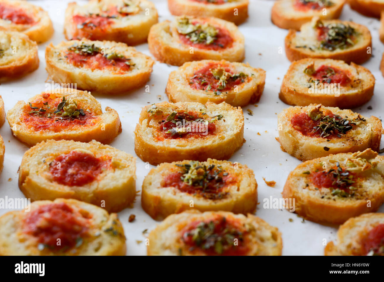 Fresh baked light and delicious bruschetta appetizers with tomato amd oregano Stock Photo