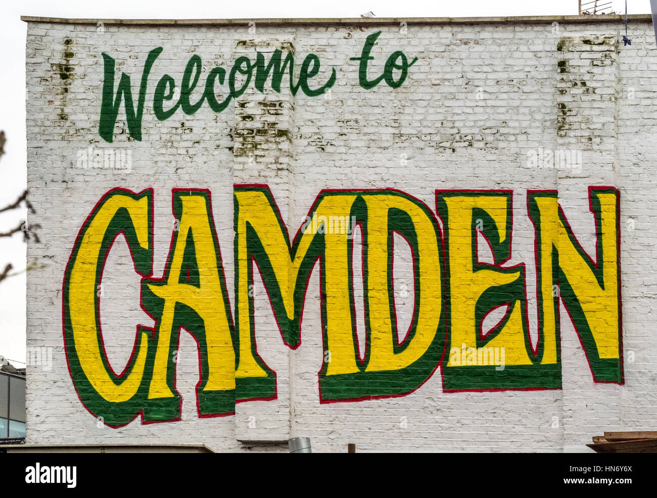 Welcome to Camden sign painted on brick wall building exterior Stock Photo