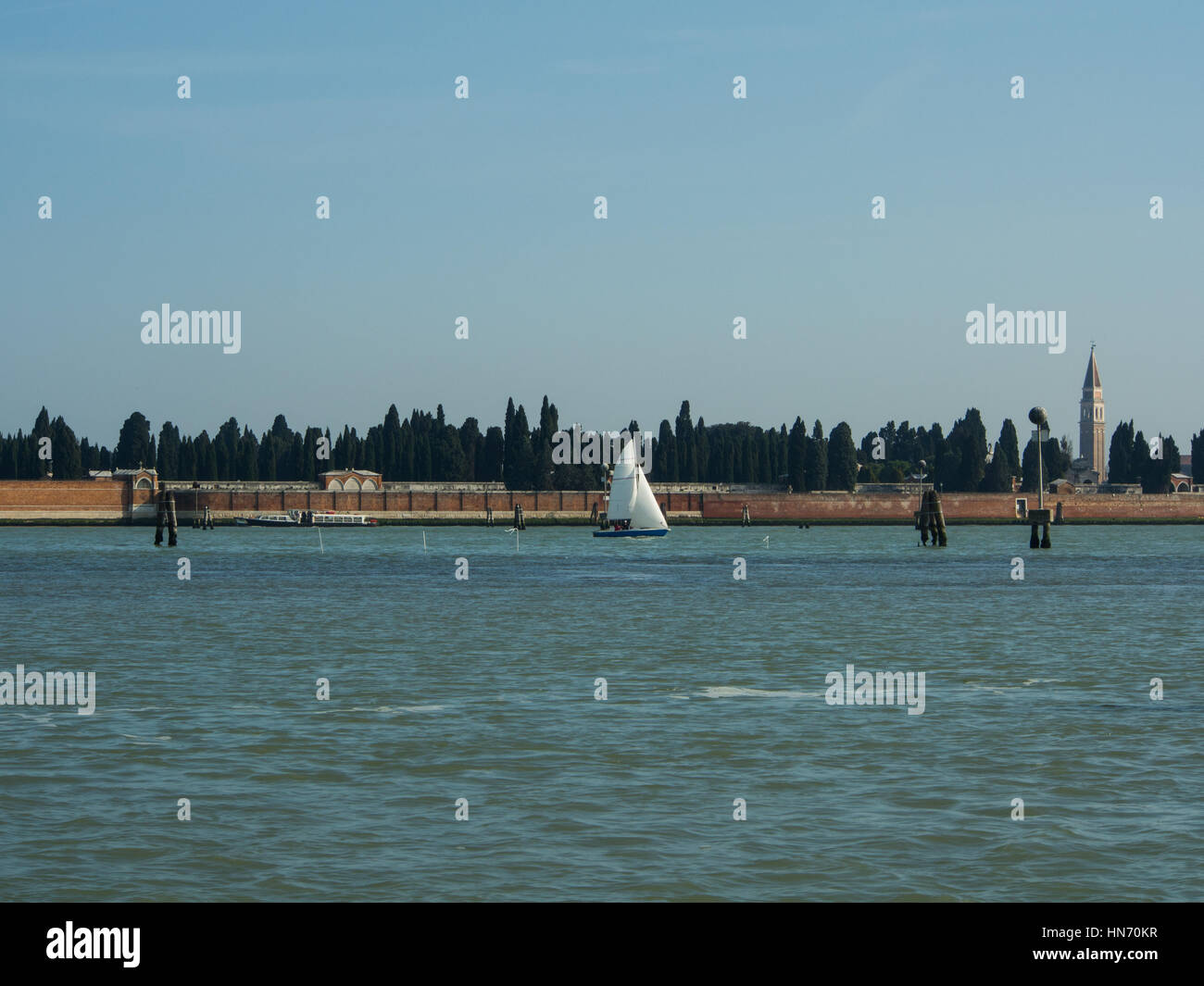 Sailing boat in Venice laguna waters near San Michele Stock Photo