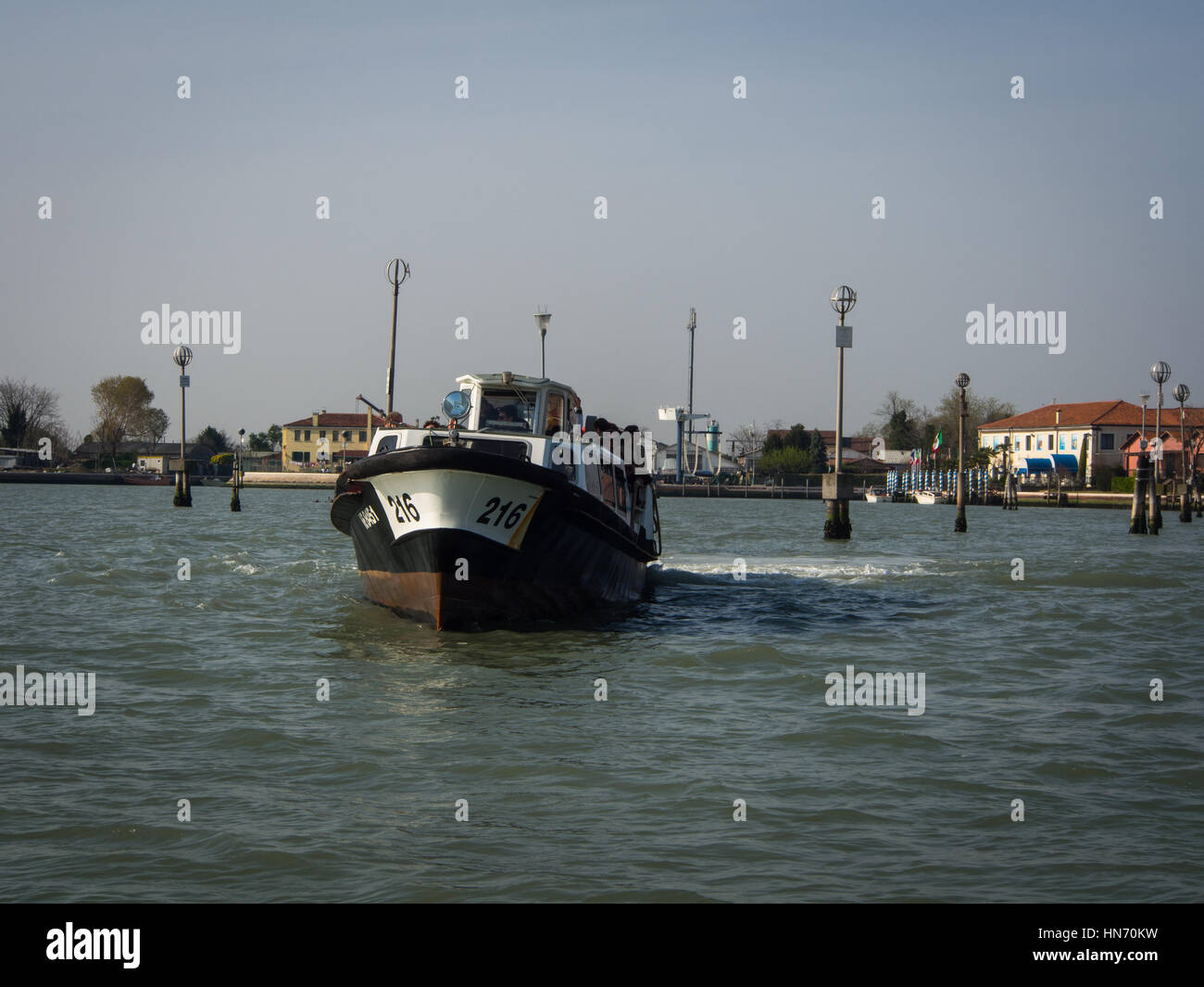 Boat in Venice laguna waters near San Michele Stock Photo