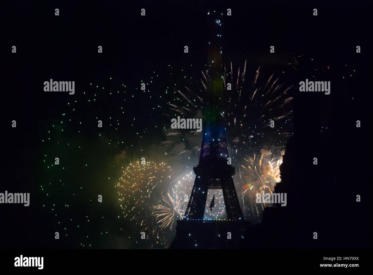 Fireworks behind Eiffel Tower on Bastilia Day in Paris Stock Photo