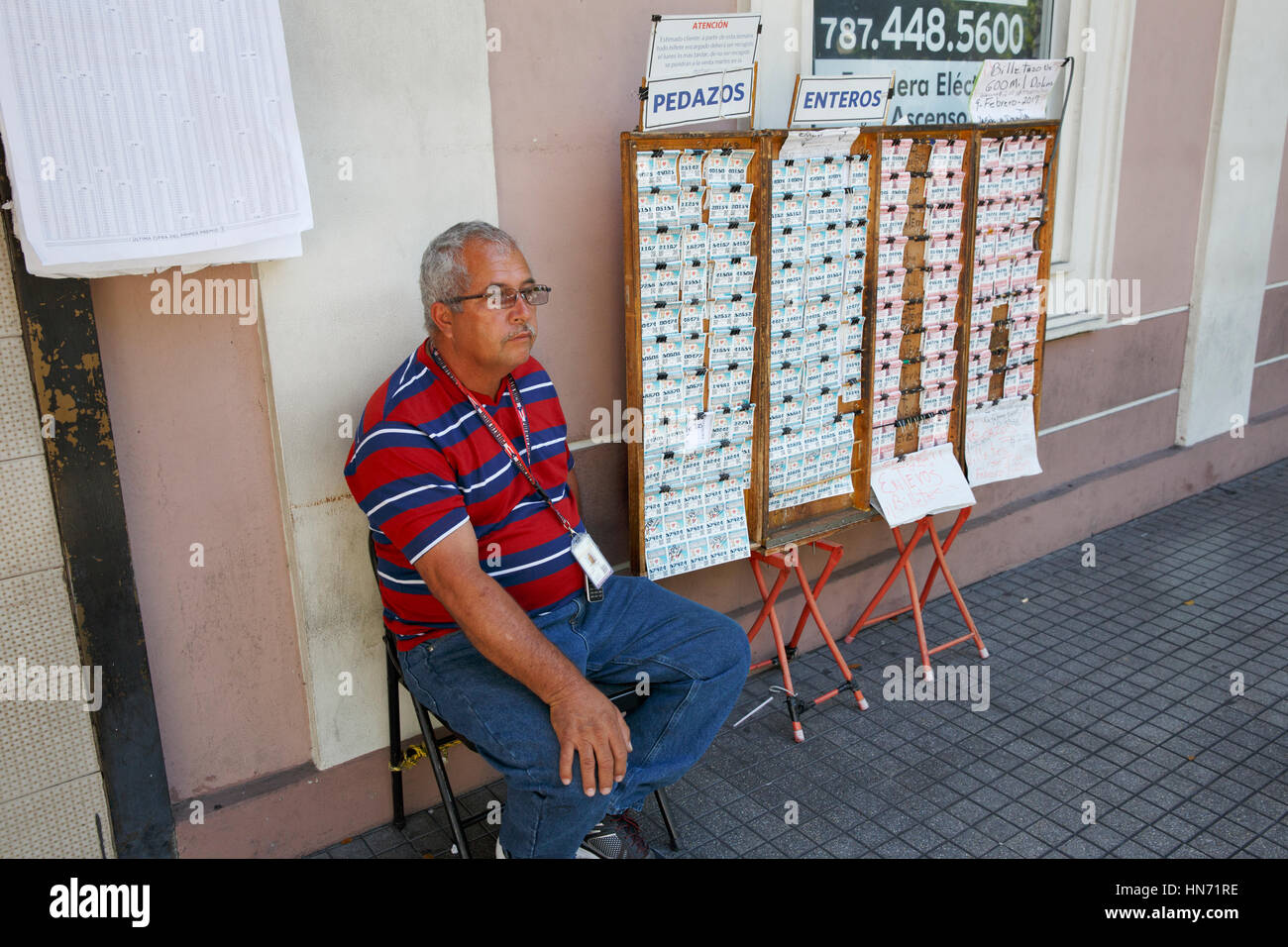 Man selling lottery tickets, street scene, Ponce, Puerto Rico Stock Photo -  Alamy