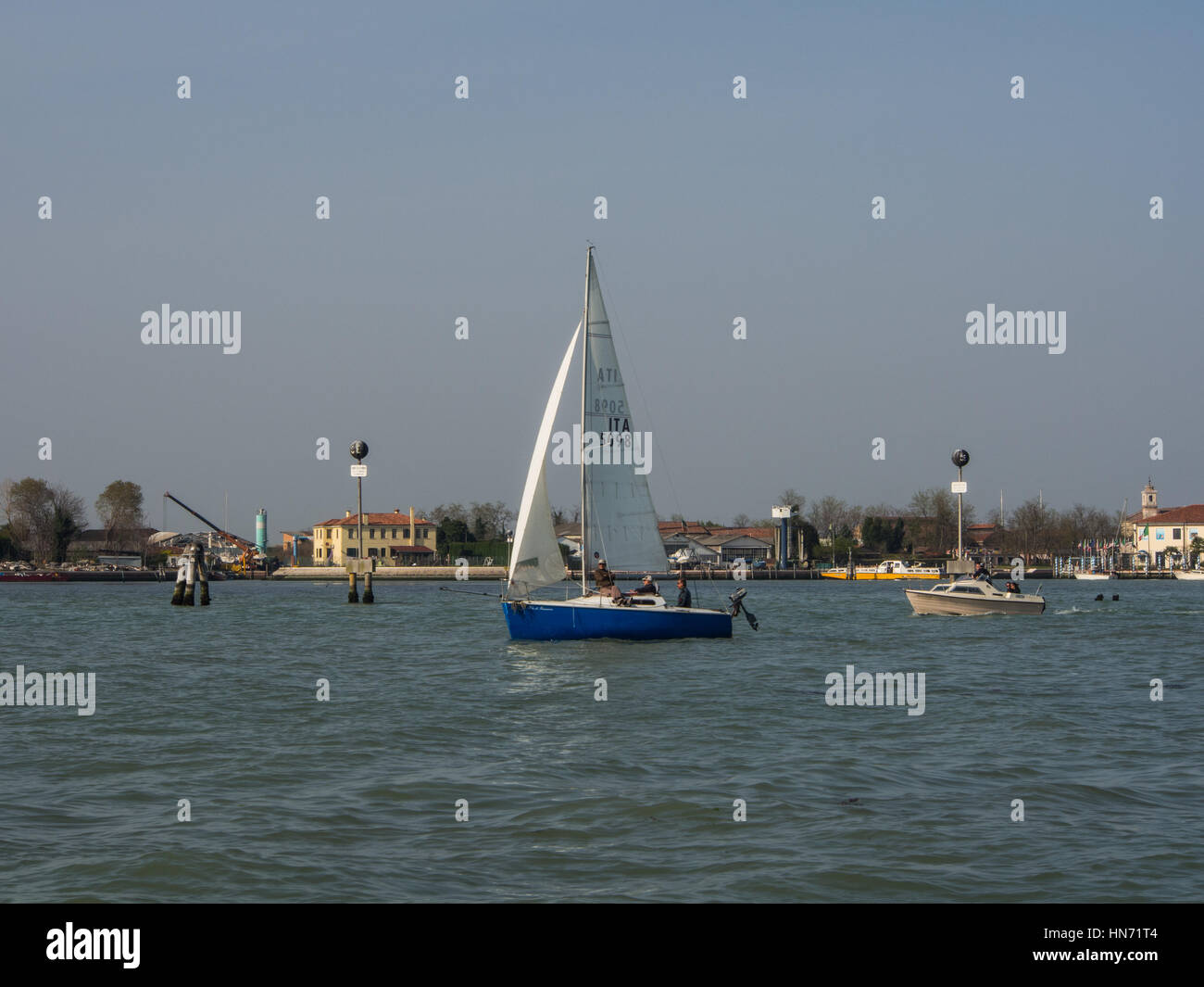 Sailing boat in Venice laguna waters near San Michele Stock Photo