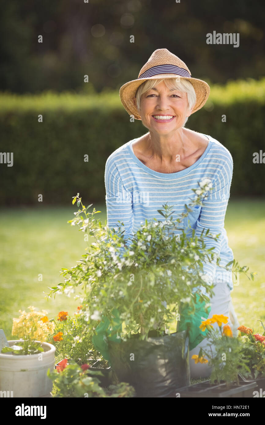 Portrait of happy senior woman gardening in backyard Stock Photo - Alamy