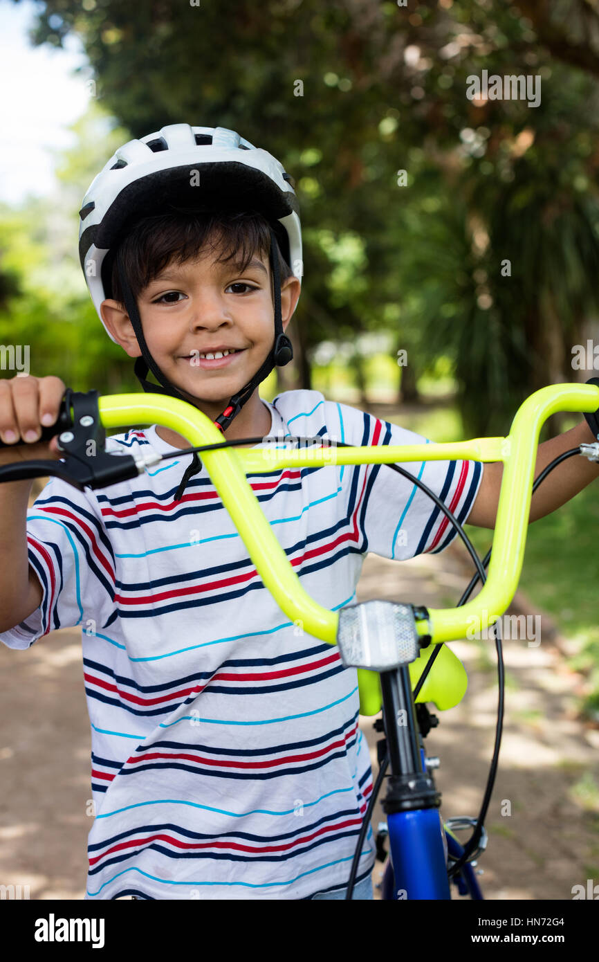 Boy standing with his bicycle hires stock photography and images Alamy