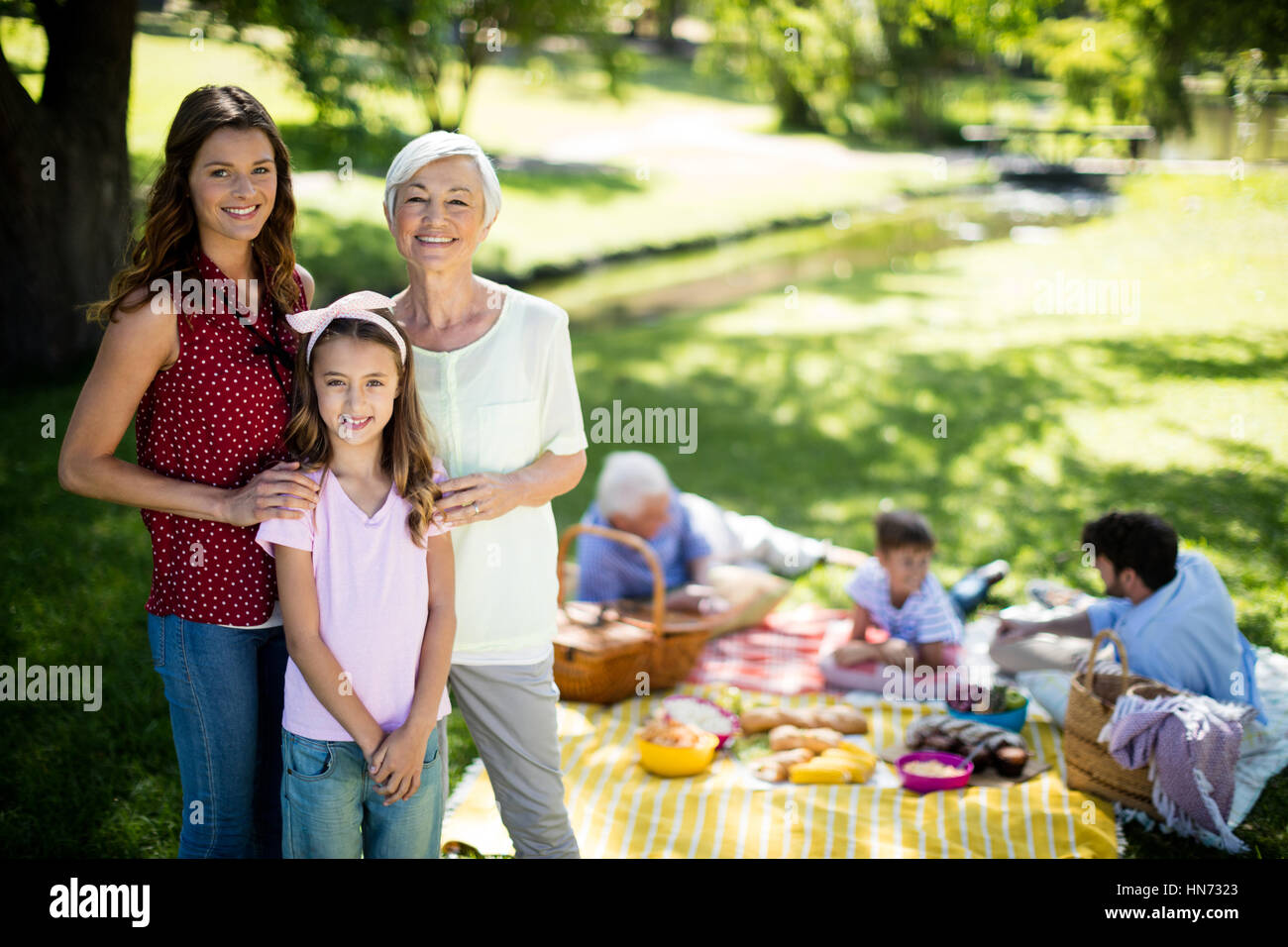 Happy family enjoying in park on sunny a day Stock Photo - Alamy