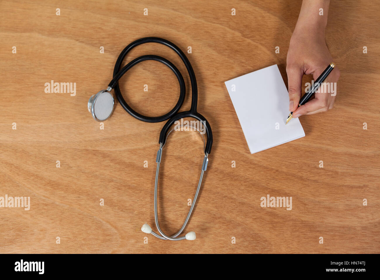 Doctor hand writing prescription on hi-res stock photography and images ...