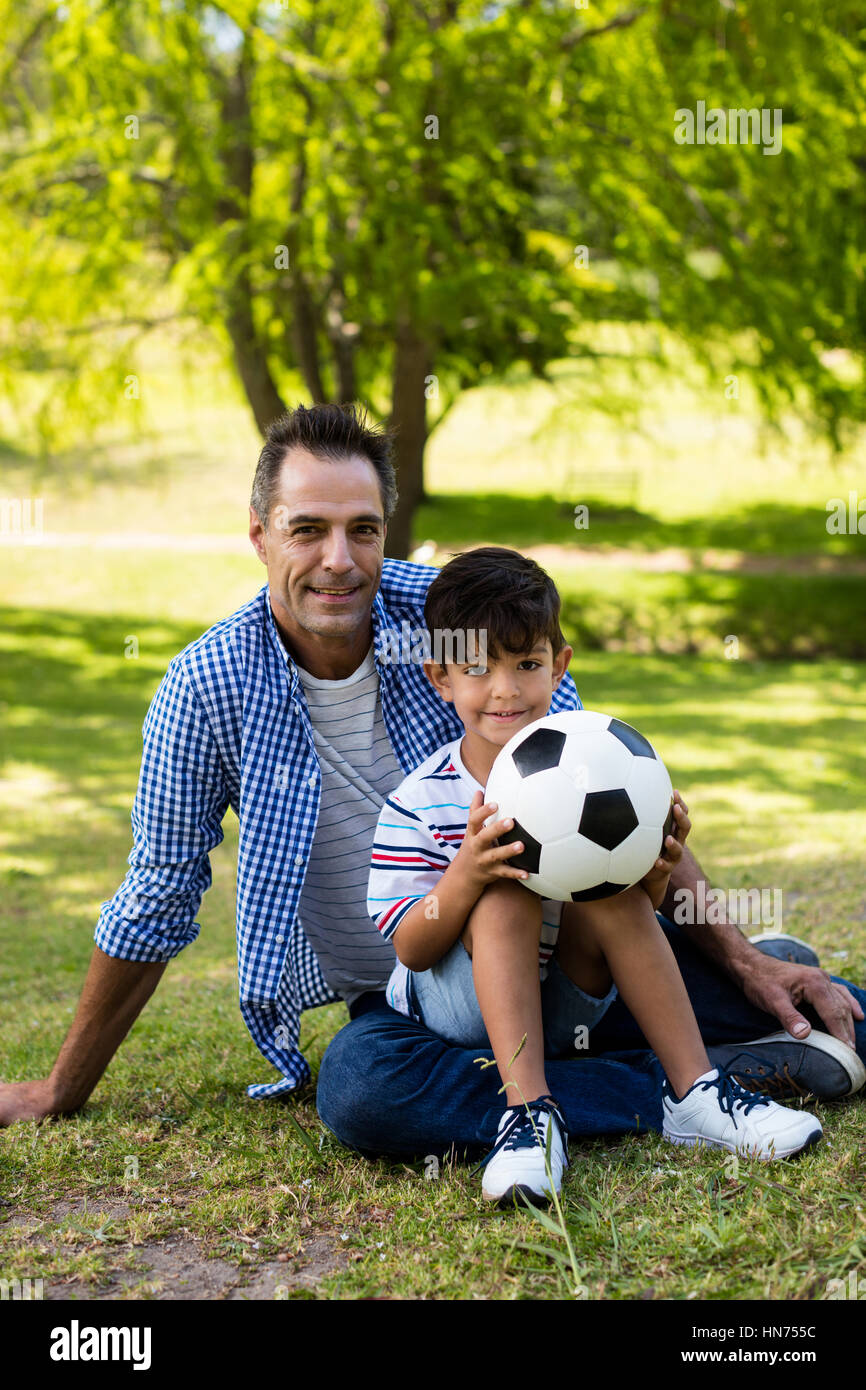 Son sitting on father lap hi-res stock photography and images - Alamy