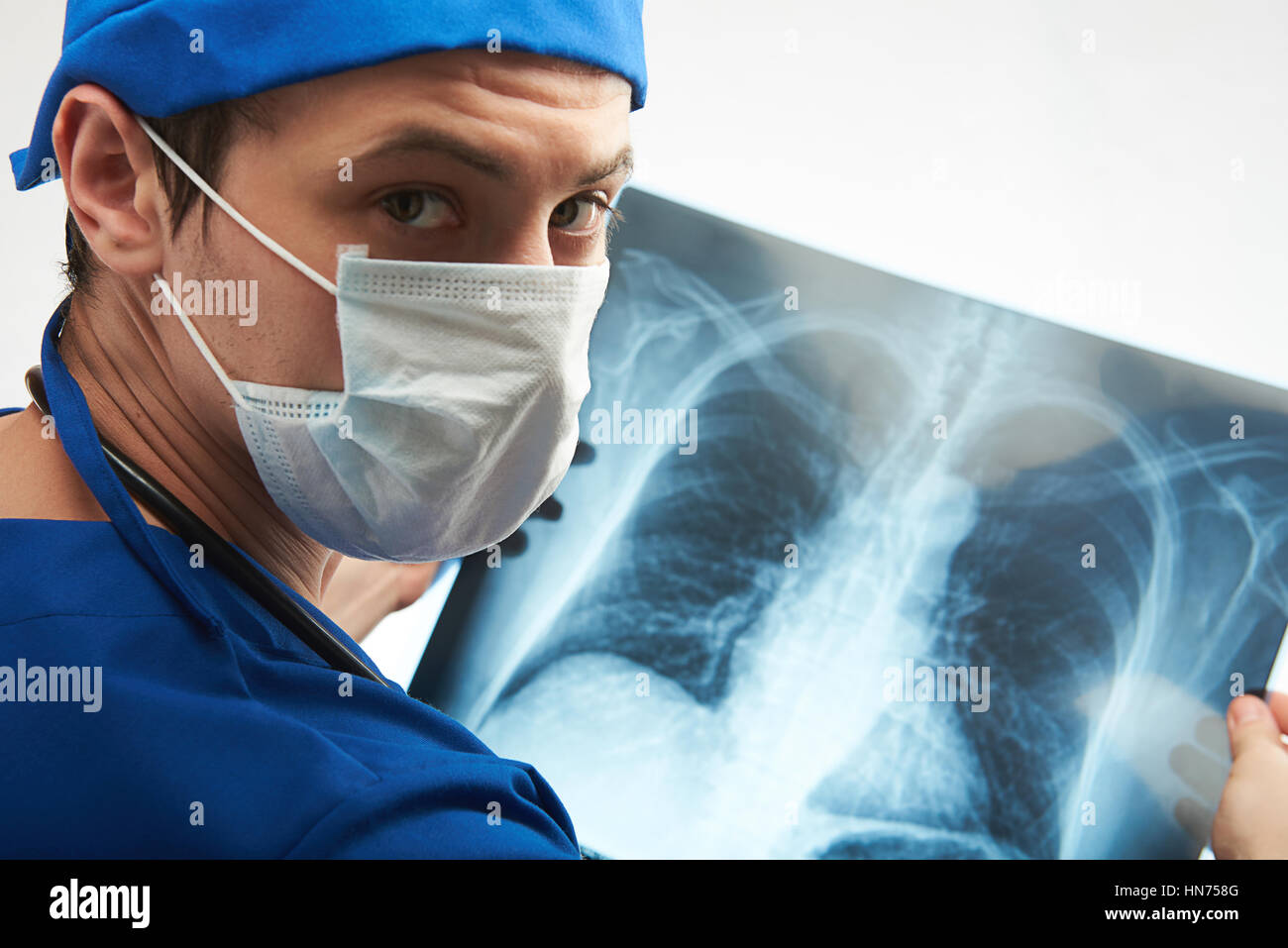 close up of doctor holding x-ray result of chest isolated on white Stock Photo