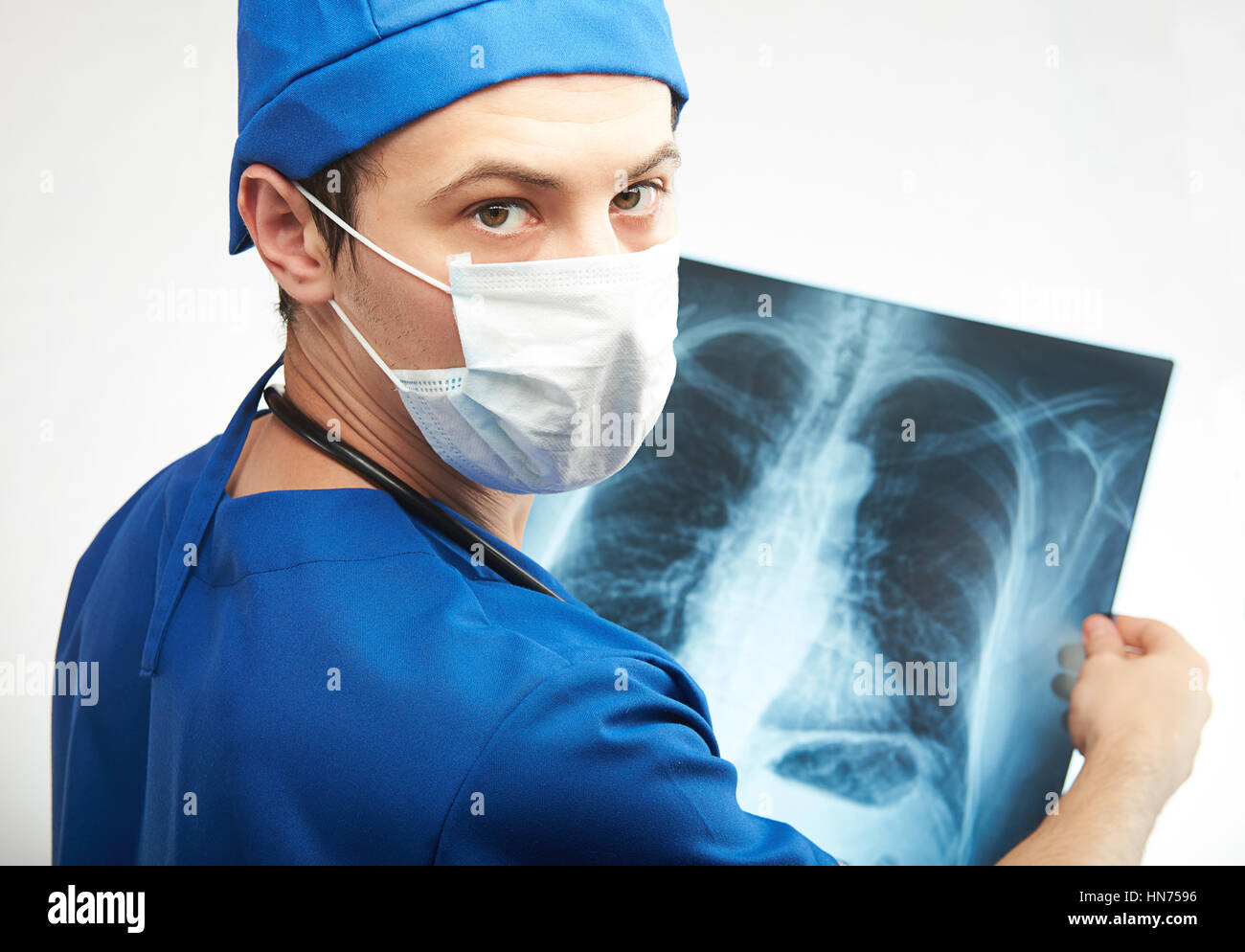 nurse man with x-ray image in hands isolated on white Stock Photo