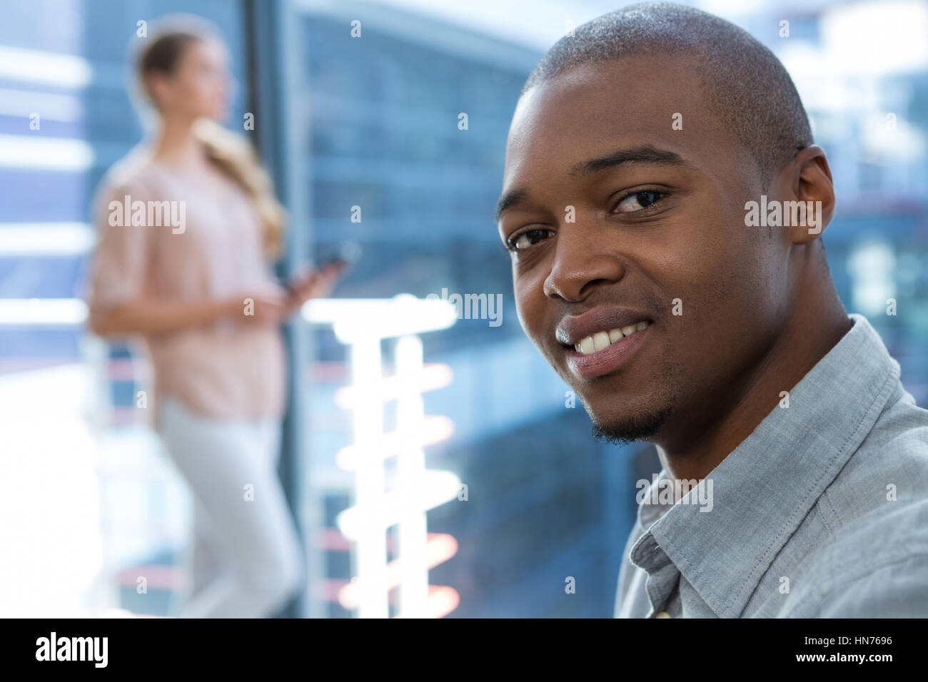 Portrait of business executives smiling in office Stock Photo - Alamy