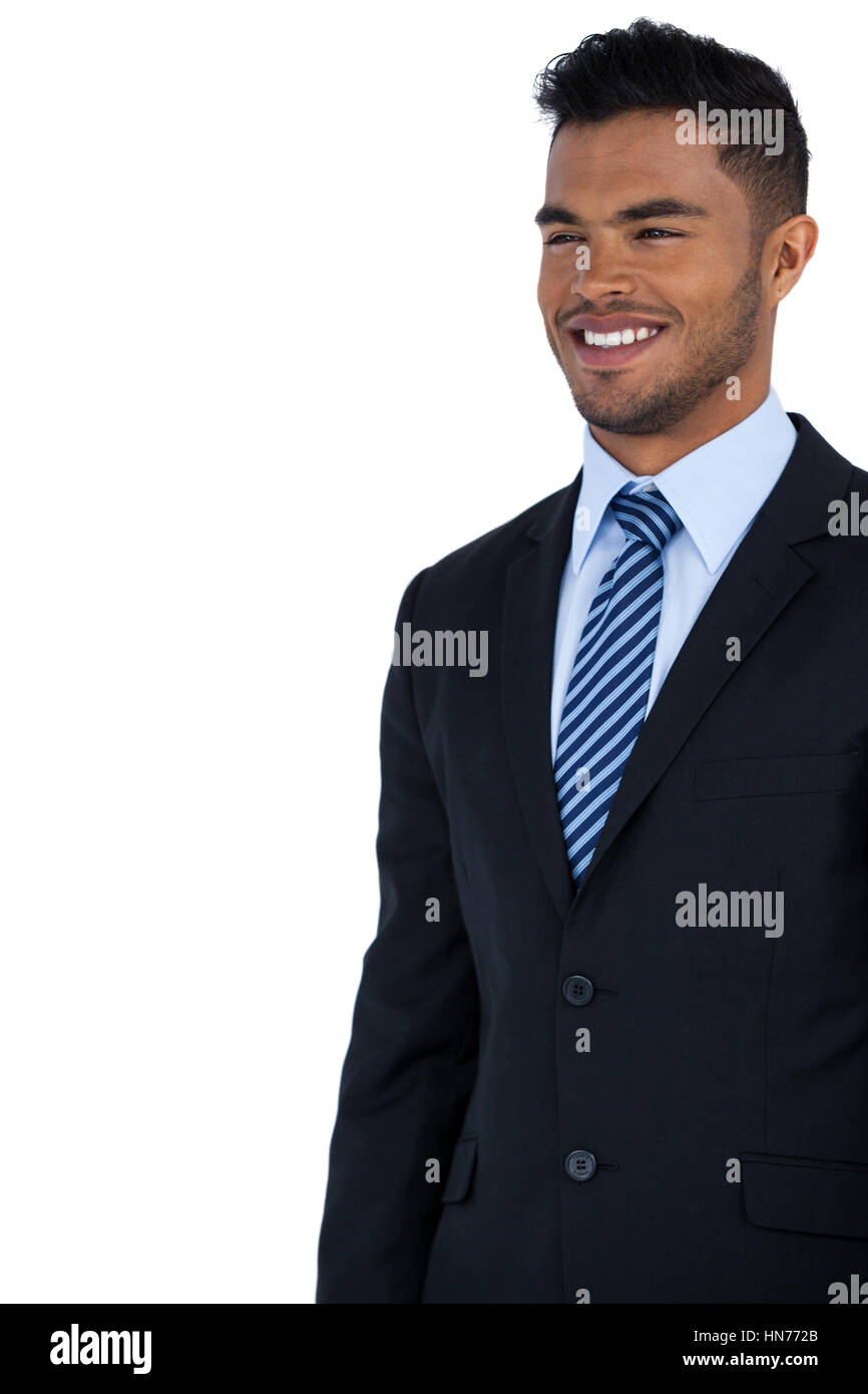Smiling businessman standing against white background Stock Photo - Alamy