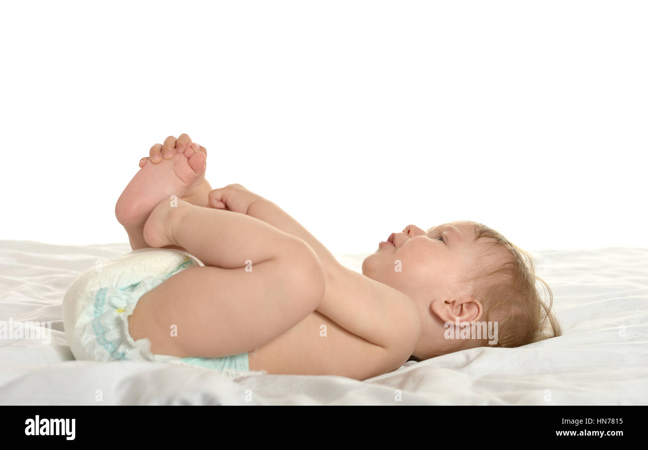 Baby girl lying in pampers Stock Photo - Alamy