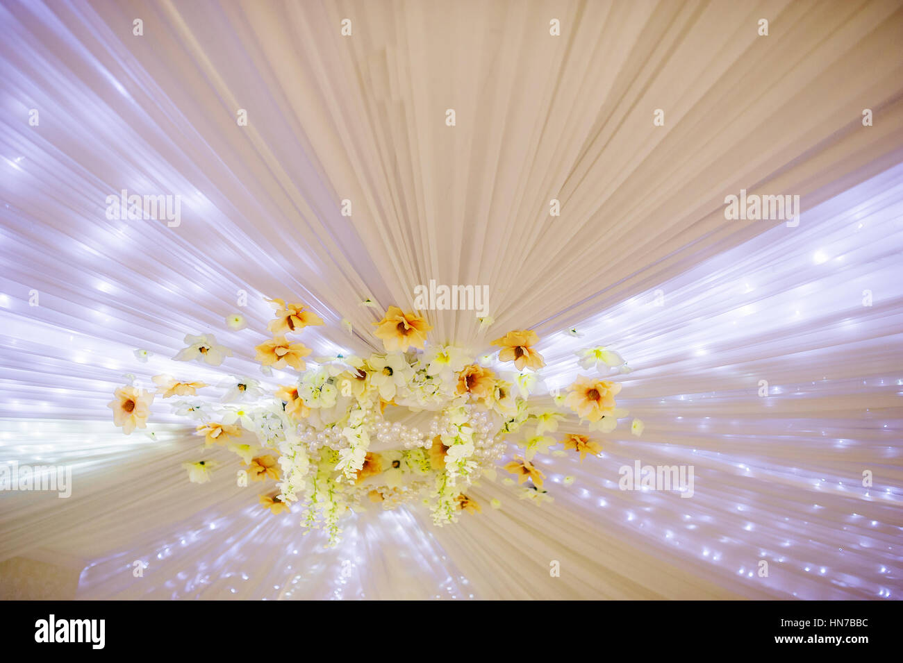 Element of wedding decor flowers and lights on ceiling at great wedding ...