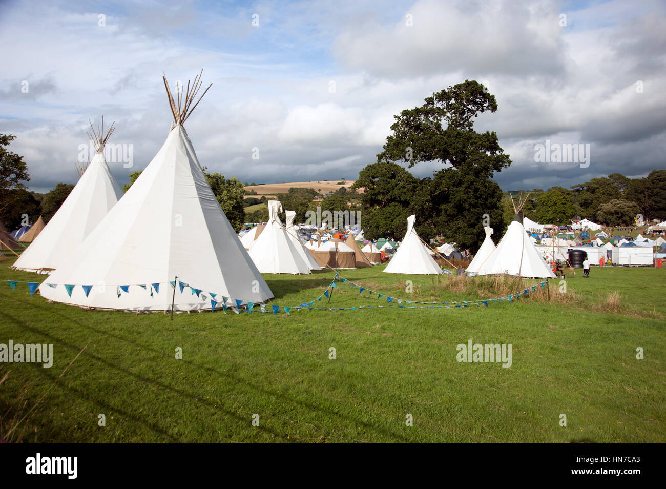 Tents and teepees in a campsite field at the Port Eliot Festival Cornwall Stock Photo