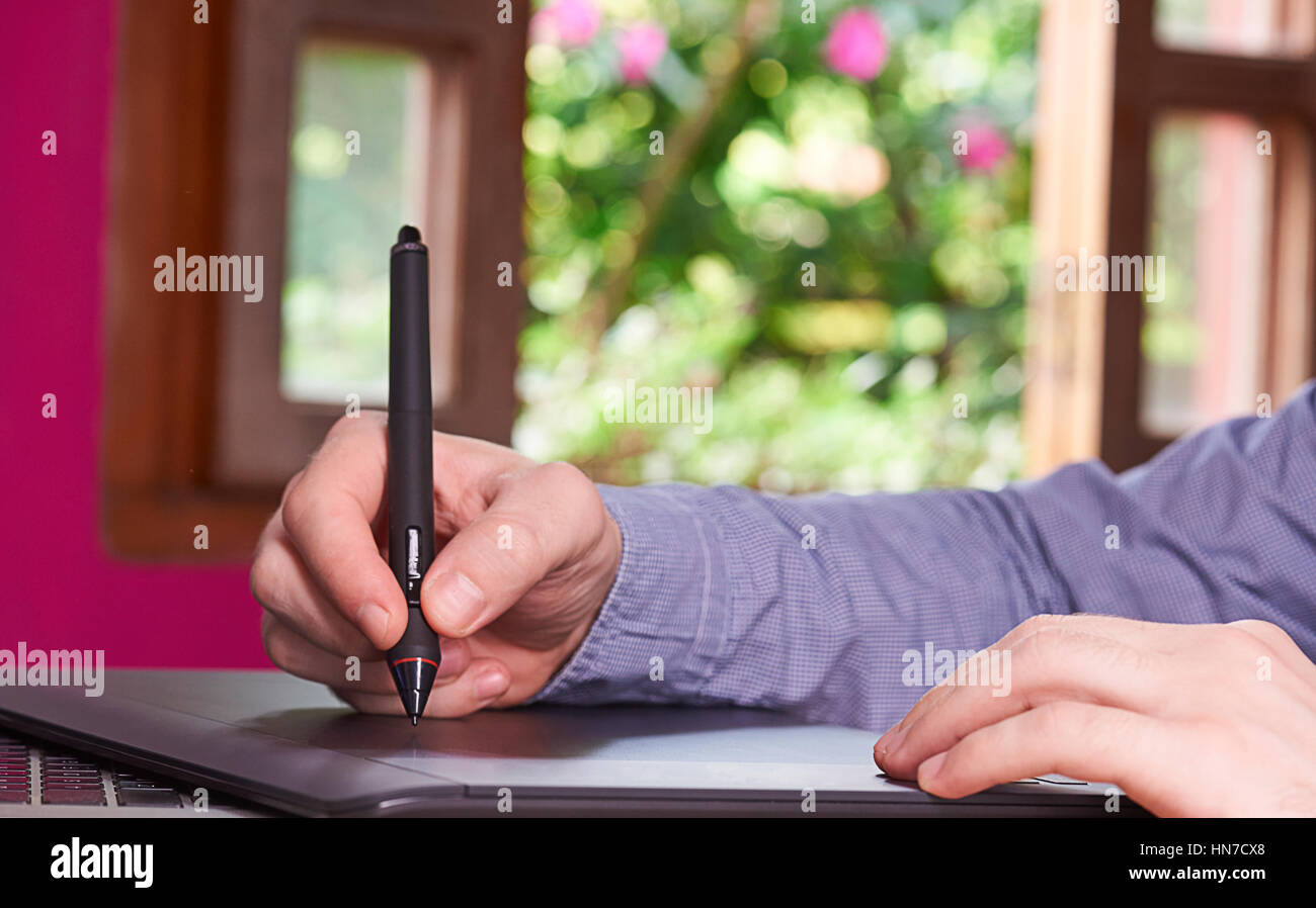 designer drawing on tablet architecture plan Stock Photo Alamy