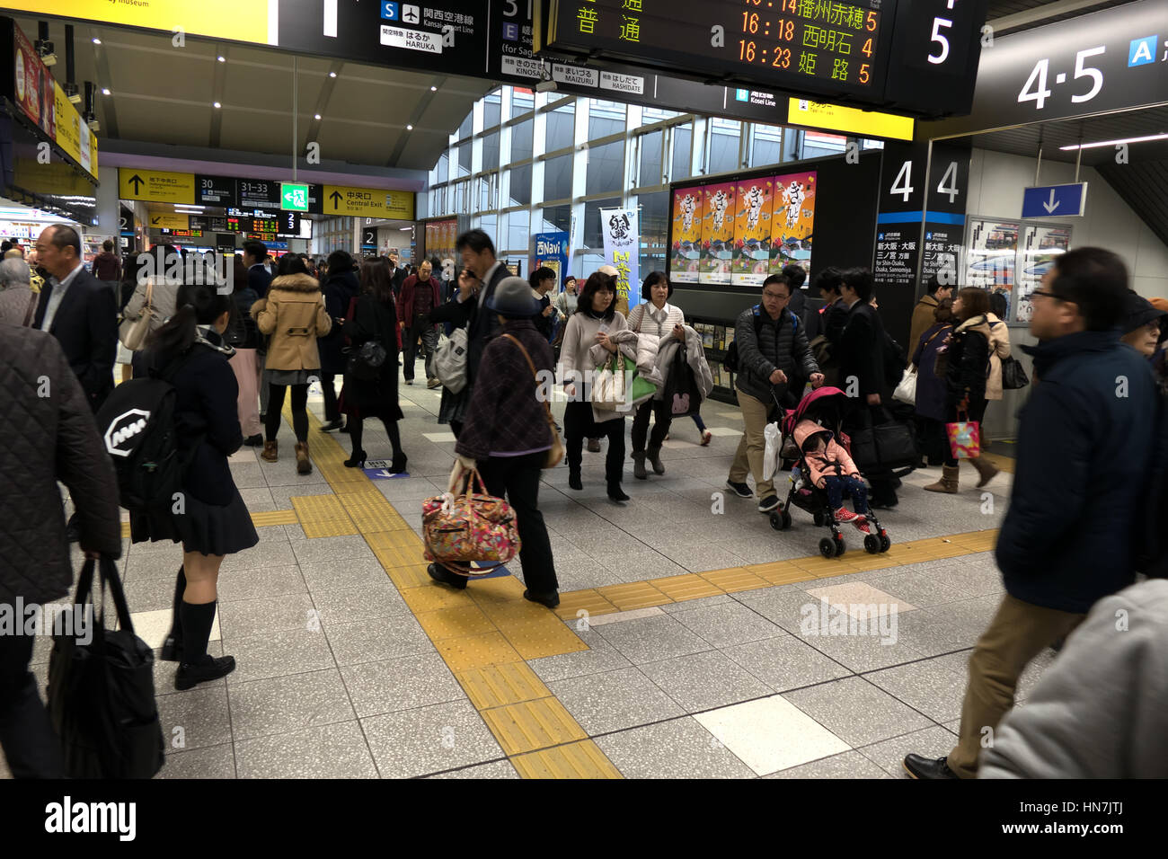 People and crowd at Kyoto JR railway station, Japan, Asia. Rush hour for Japanese travelers and Asian commuters running to catch a train Stock Photo