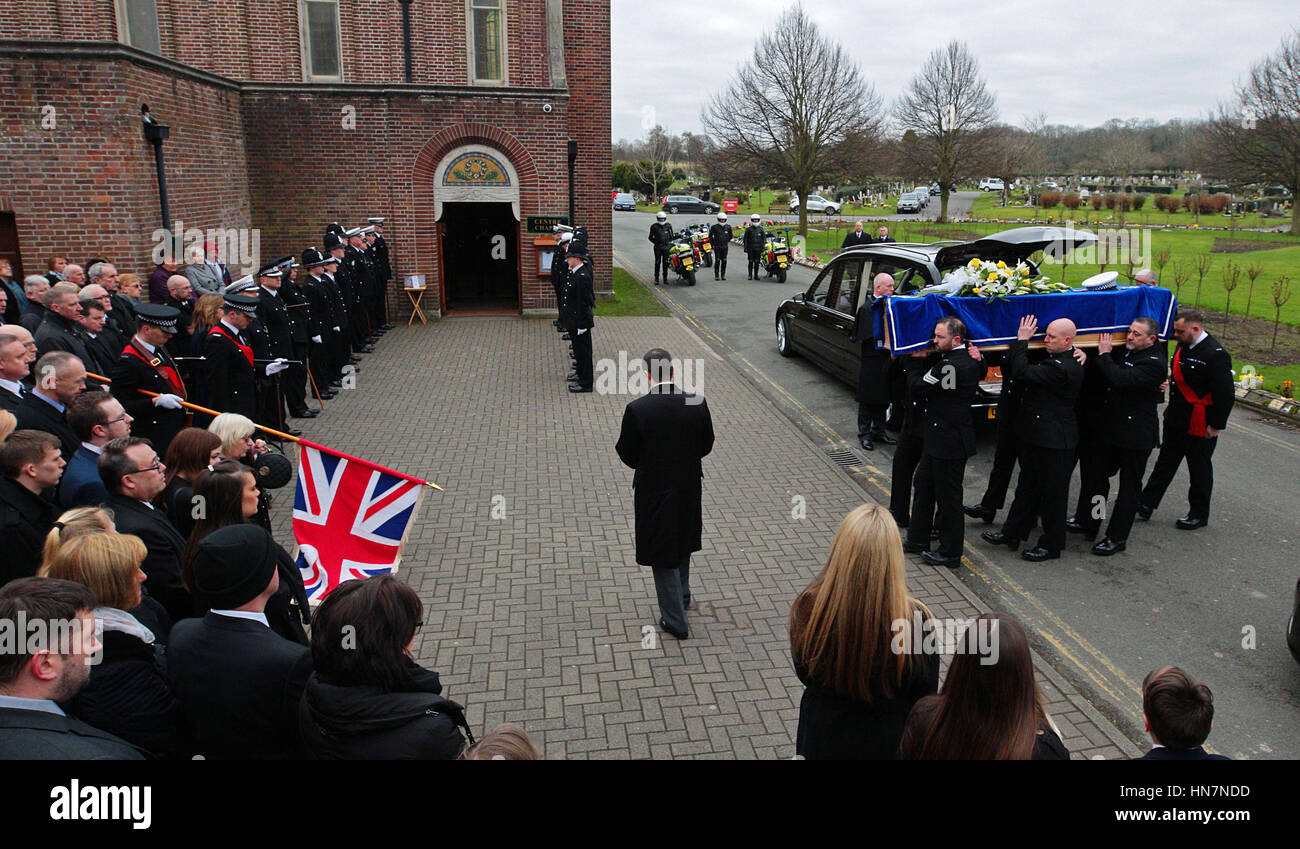 The coffin of PC Paul Briggs is carried in to the chapel at Landican