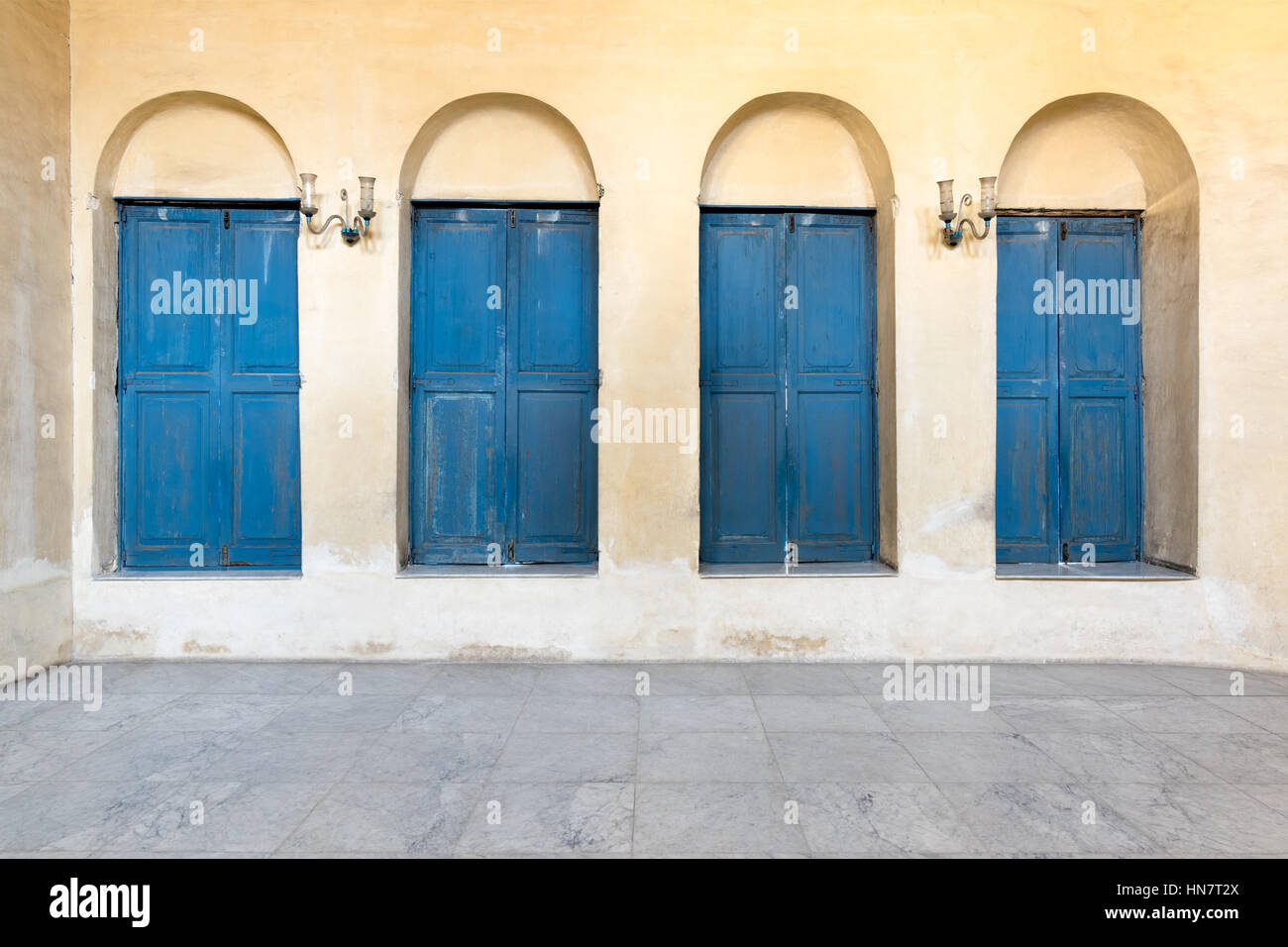 Vintage four blue wooden window of a old historic building with vintage ...