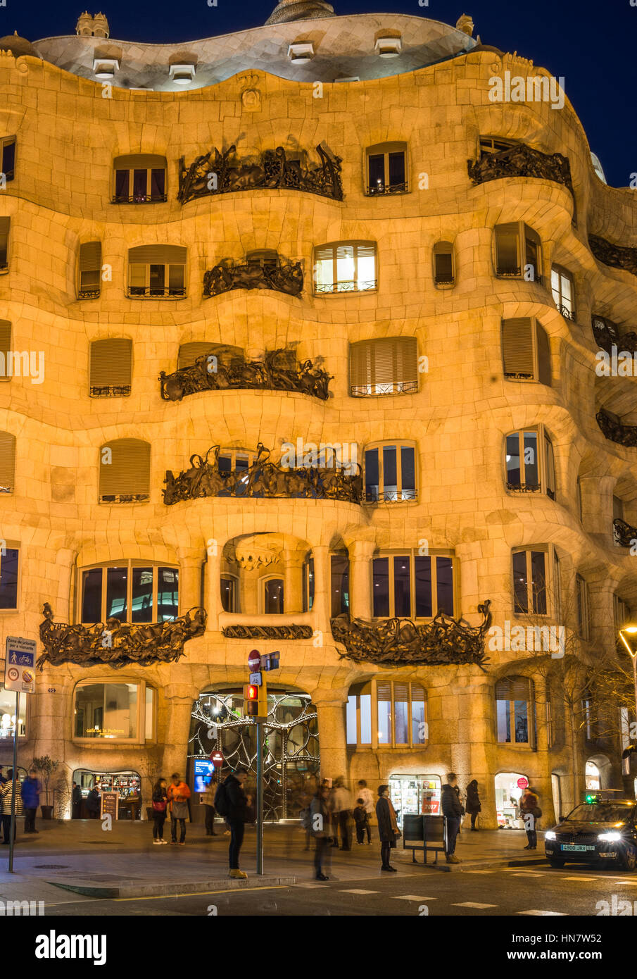 Gaudi's Casa Mila aka La Pedrera after dark, in Barcelona, Spain Stock Photo