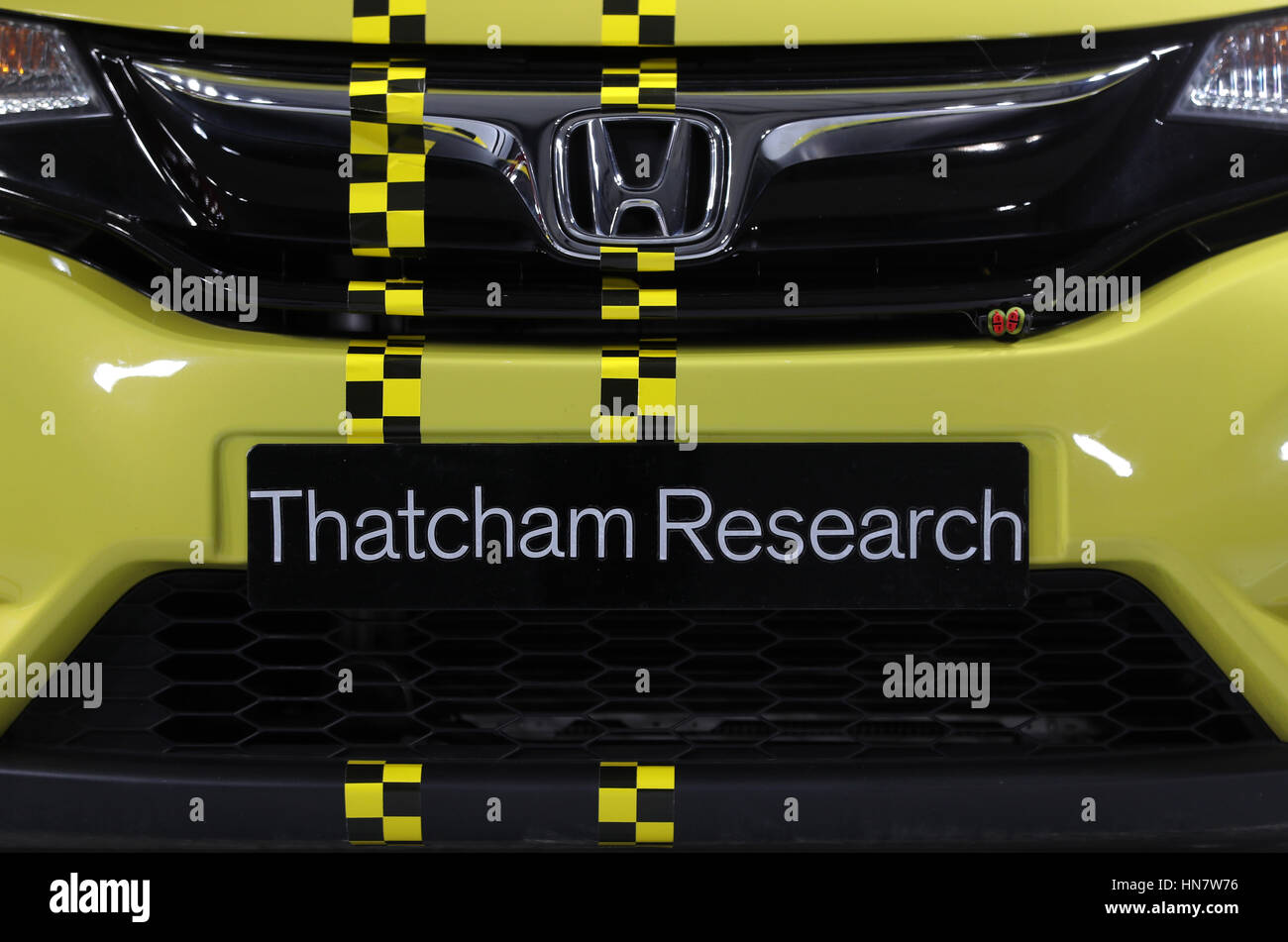 Chequered tape on the bonnet of a Honda Jazz inside the crash test facility at Thatcham Research in Berskshire Stock Photo