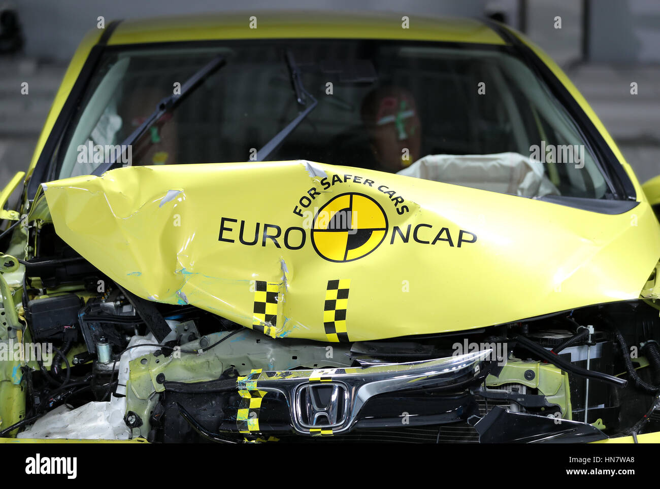 A Euro NCAP sign on the bonnet of a Honda Jazz after a crash test at  Thatcham Research in Berskshire Stock Photo - Alamy
