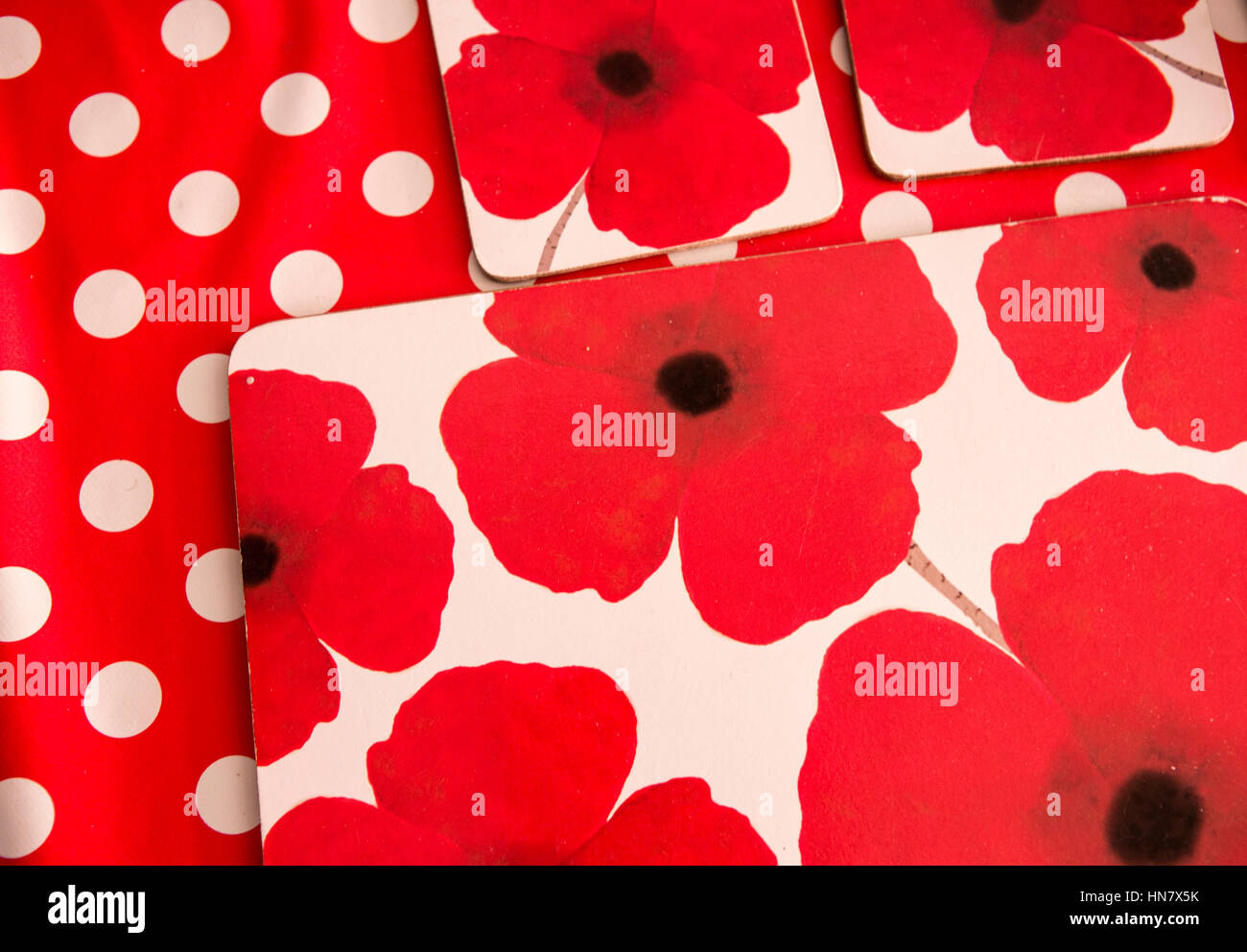 Red poppy patterned table place settings, palce mats and drinks
