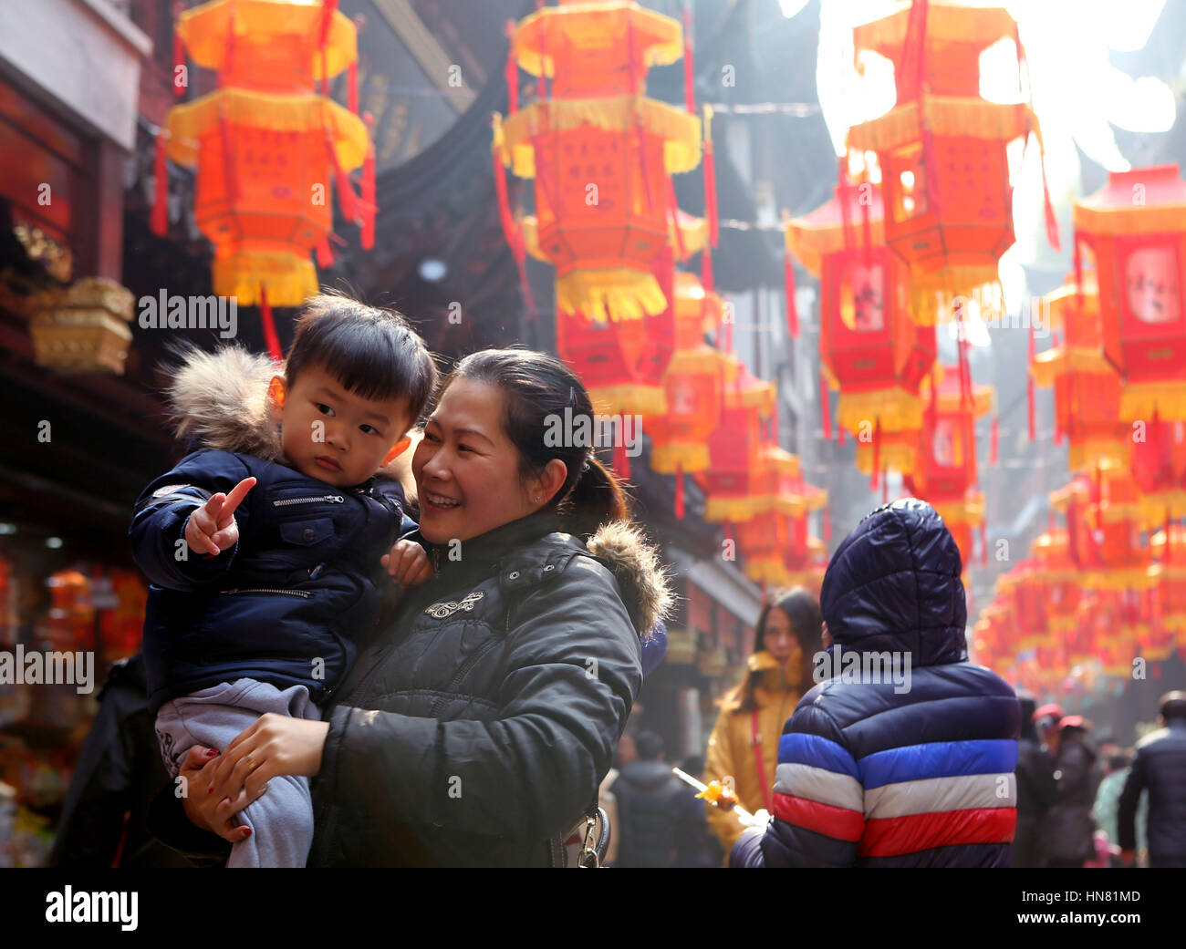 Shanghai, China. 9th Feb, 2017. People pose for photos at Yu Garden in ...