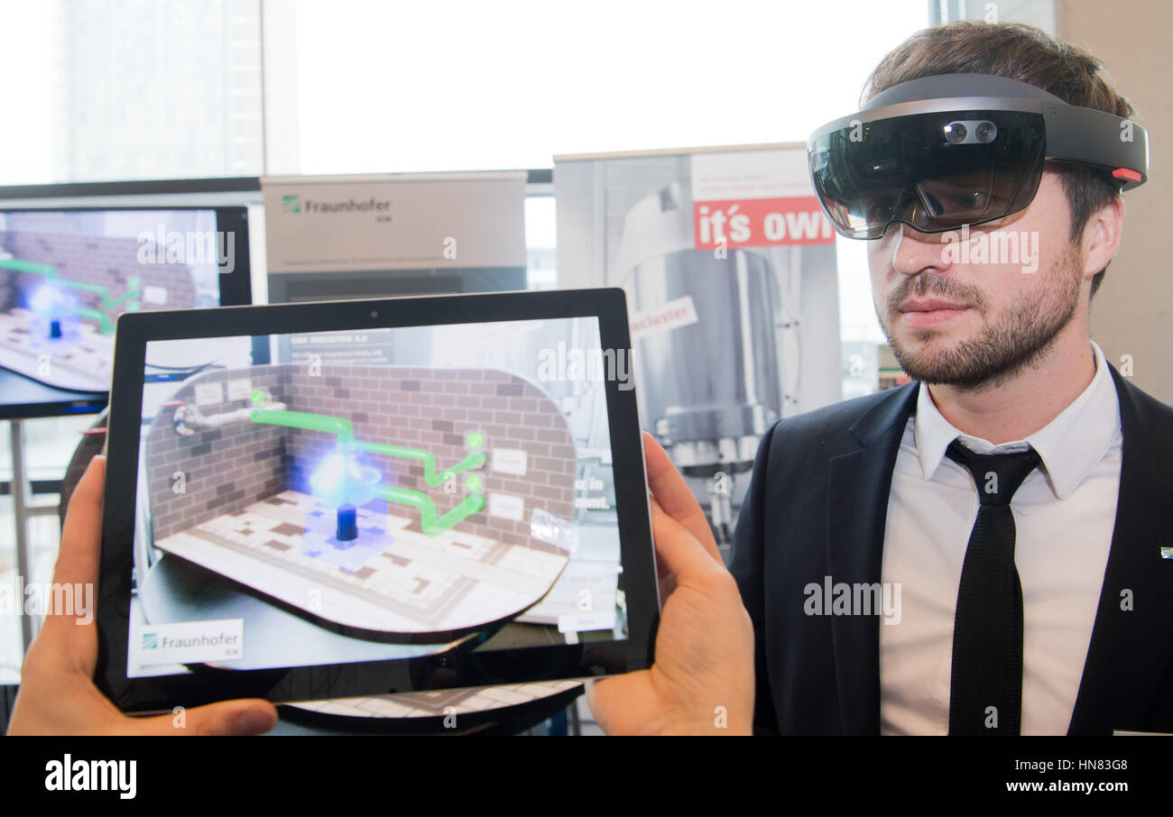 Hanover, Germany. 09th Feb, 2017. Daniel Nickchen from the Frauenhofer Institute for Mechatronic Systems Design IEM wears smartglasses for computerized augemented reality during a press conference on the Hannover Messe in Hanover, Germany, 09 February 2017. With augmented reality (AR), objects in the real world can be linked to virtual information. The Hannover Messe, the worlds largest industrial fair, expects 6,500 exhibitors from 24 until 28 April 2017. The 2017 partner country in Poland. Photo: Julian Stratenschulte/dpa/Alamy Live News Stock Photo