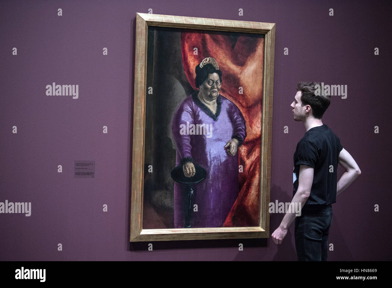 Duesseldorf, Germany. 09th Feb, 2017. A visitor looks at an artwork entitled 'Bildnis der Kunsthaendlerin Johanna Ey' (lit. Portrait of art dealer Johanna Ey) by artist Otto Dix from 1924, in Duesseldorf, Germany, 09 February 2017. The artist's formative years in the lively art scene of the region are the focal point of a large-scale exhibition entitled 'Otto Dix. The Evil Eye, ' which will run from 11 February until 14 May 2017 at the North Rhine-Westphalian Art Collection. Photo: Federico Gambarini/dpa/Alamy Live News Stock Photo