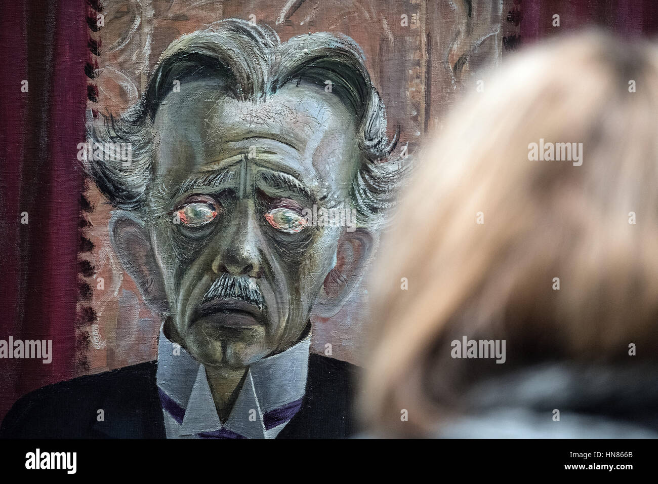 Duesseldorf, Germany. 09th Feb, 2017. A visitor looks at an artwork entitled 'Bildnis des Dr. Heinrich Stadelmann' (lit. Portrait of Dr. Heinrich Stadelmann) by artist Otto Dix from 1922, in Duesseldorf, Germany, 09 February 2017. The artist's formative years in the lively art scene of the region are the focal point of a large-scale exhibition entitled 'Otto Dix. The Evil Eye, ' which will run from 11 February until 14 May 2017 at the North Rhine-Westphalian Art Collection. Photo: Federico Gambarini/dpa/Alamy Live News Stock Photo